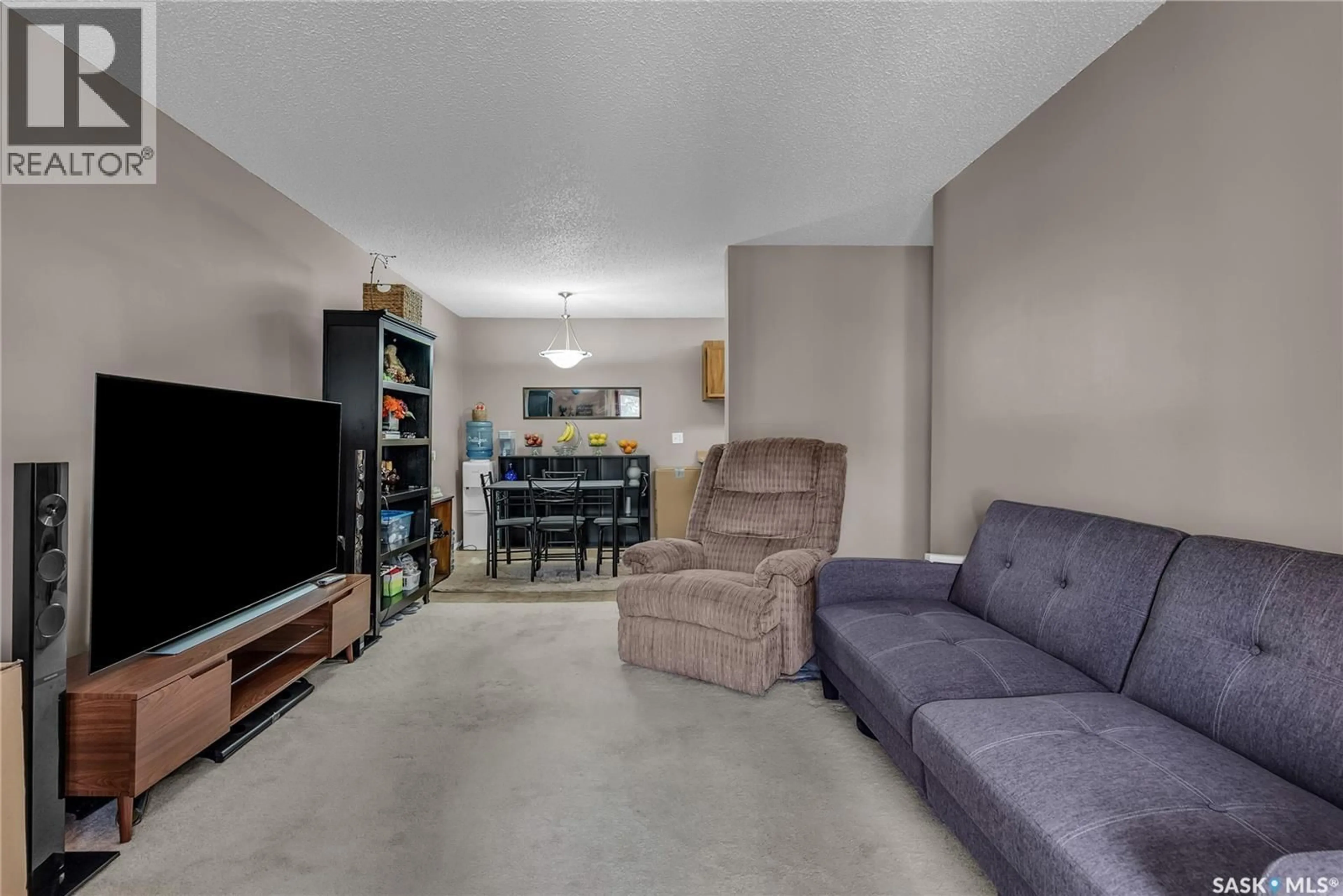 Living room with furniture, unknown for 215 - 3308 33RD STREET, Saskatoon Saskatchewan S7L6S6