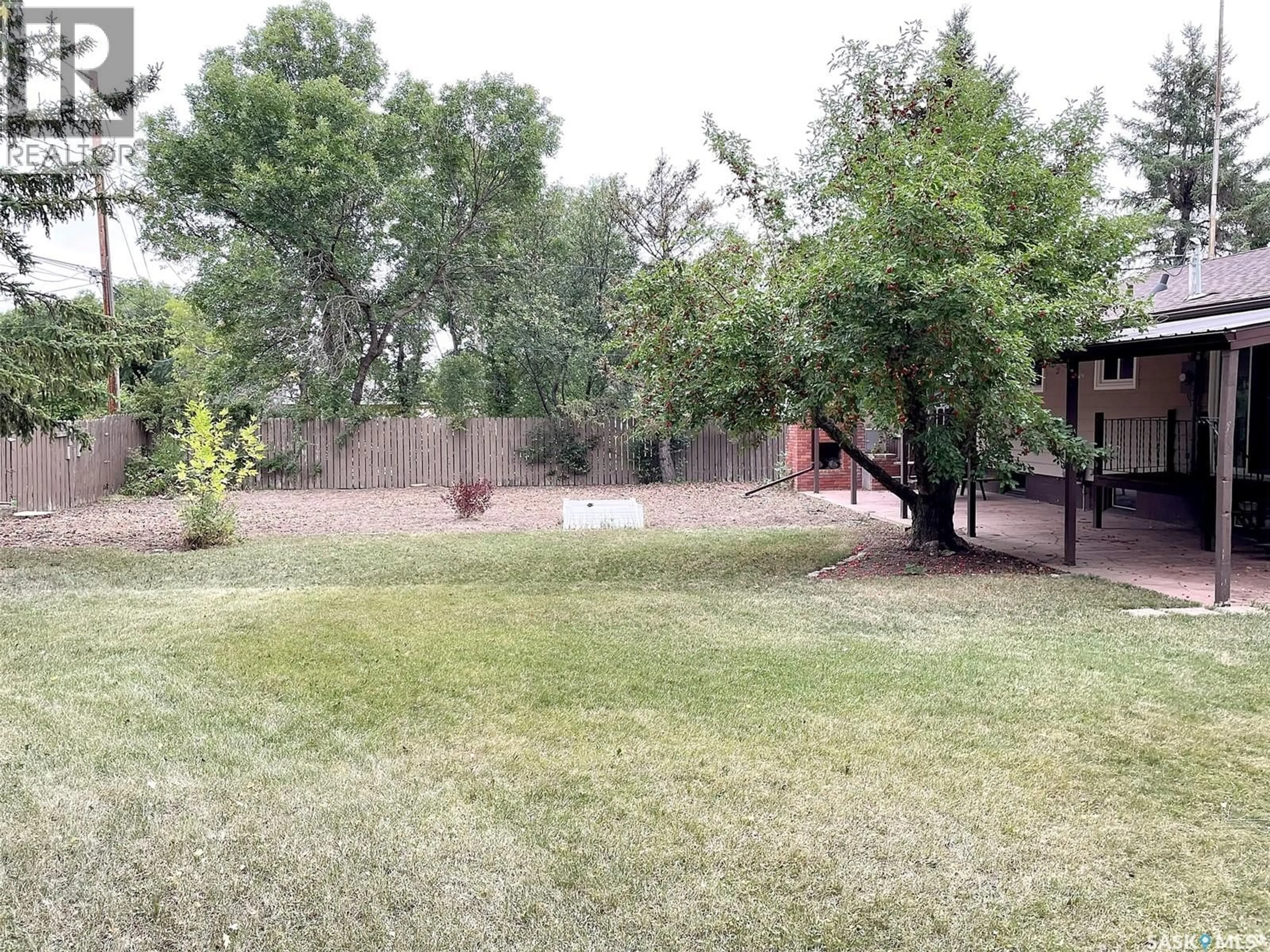 A pic from outside/outdoor area/front of a property/back of a property/a pic from drone, forest/trees view for 406 1ST STREET, Lafleche Saskatchewan S0H2K0