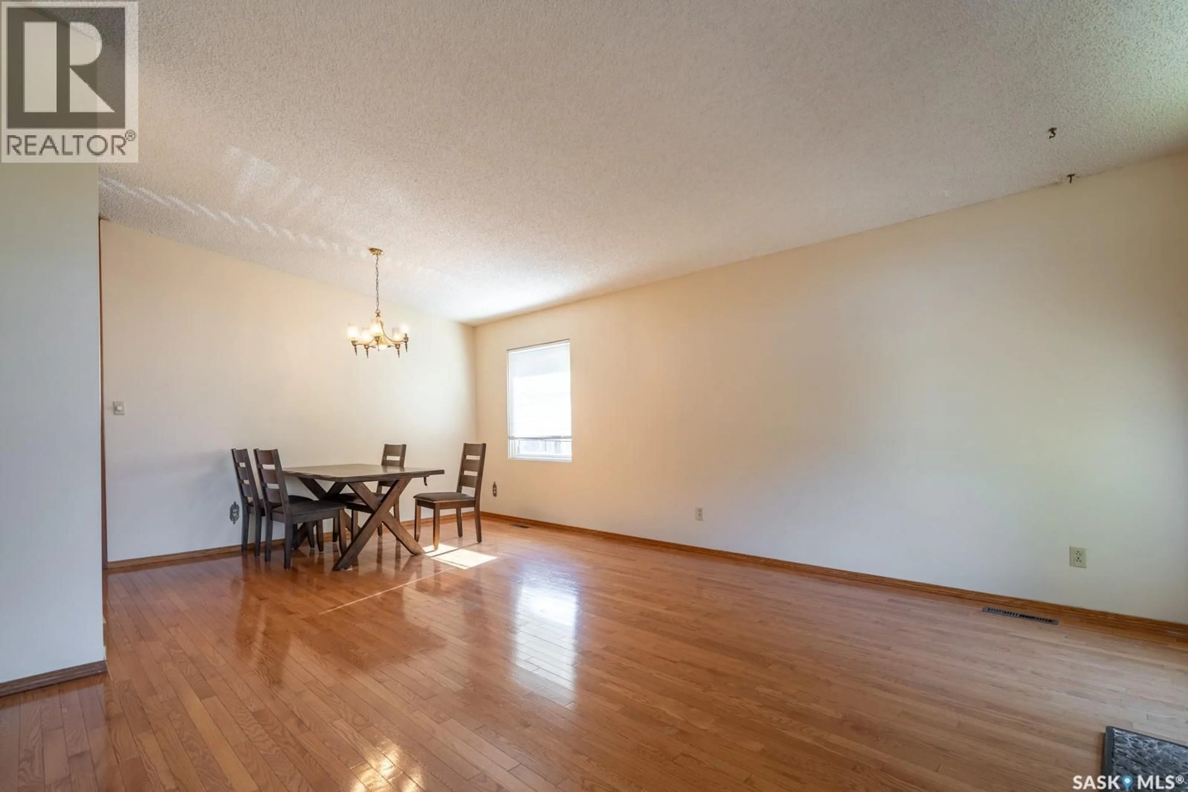 Dining room, wood/laminate floor for 51 SUNSET DRIVE, Regina Saskatchewan S4S5V6