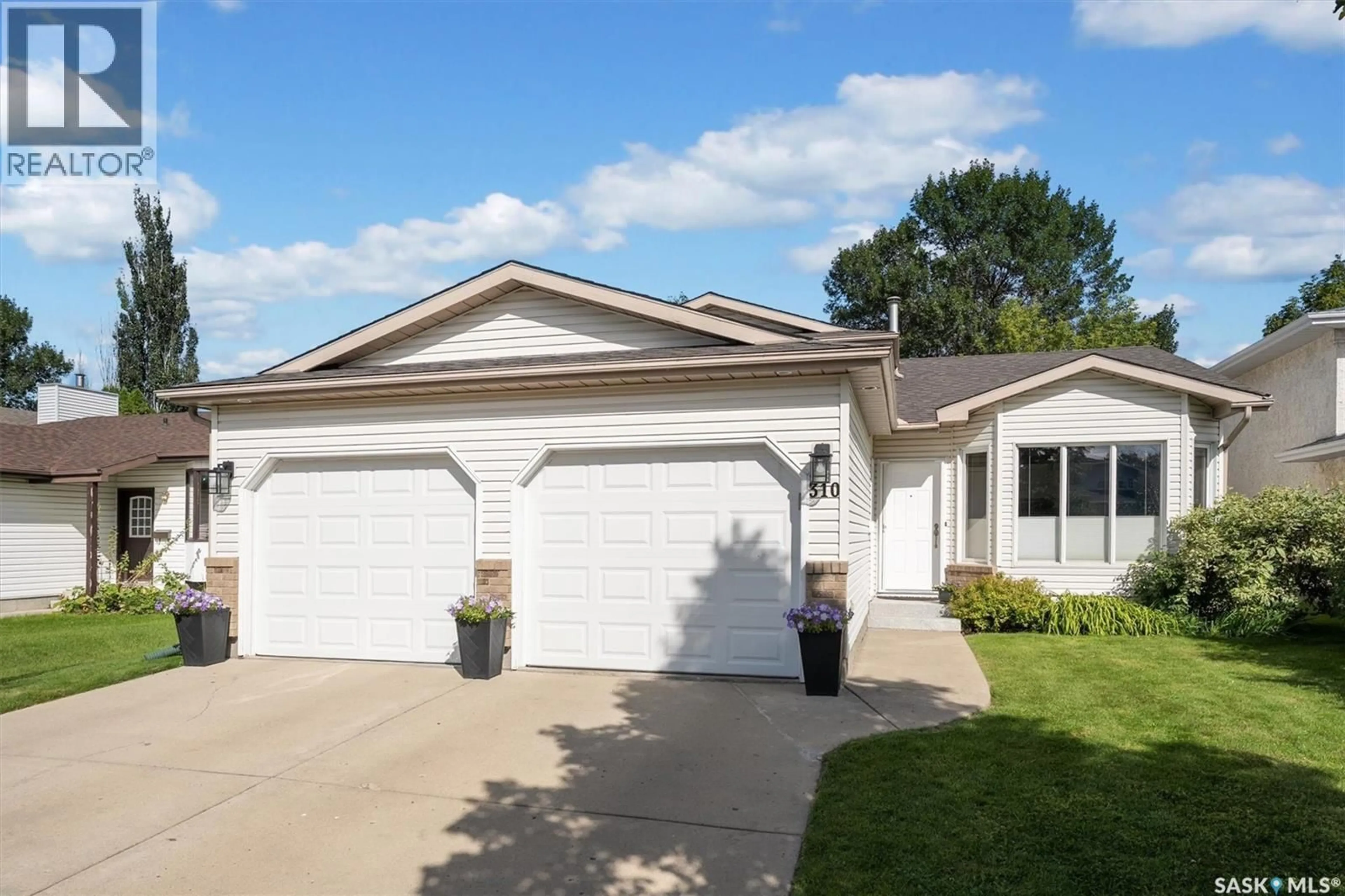 Home with vinyl exterior material, street for 310 COBEN CRESCENT, Saskatoon Saskatchewan S7S1B3