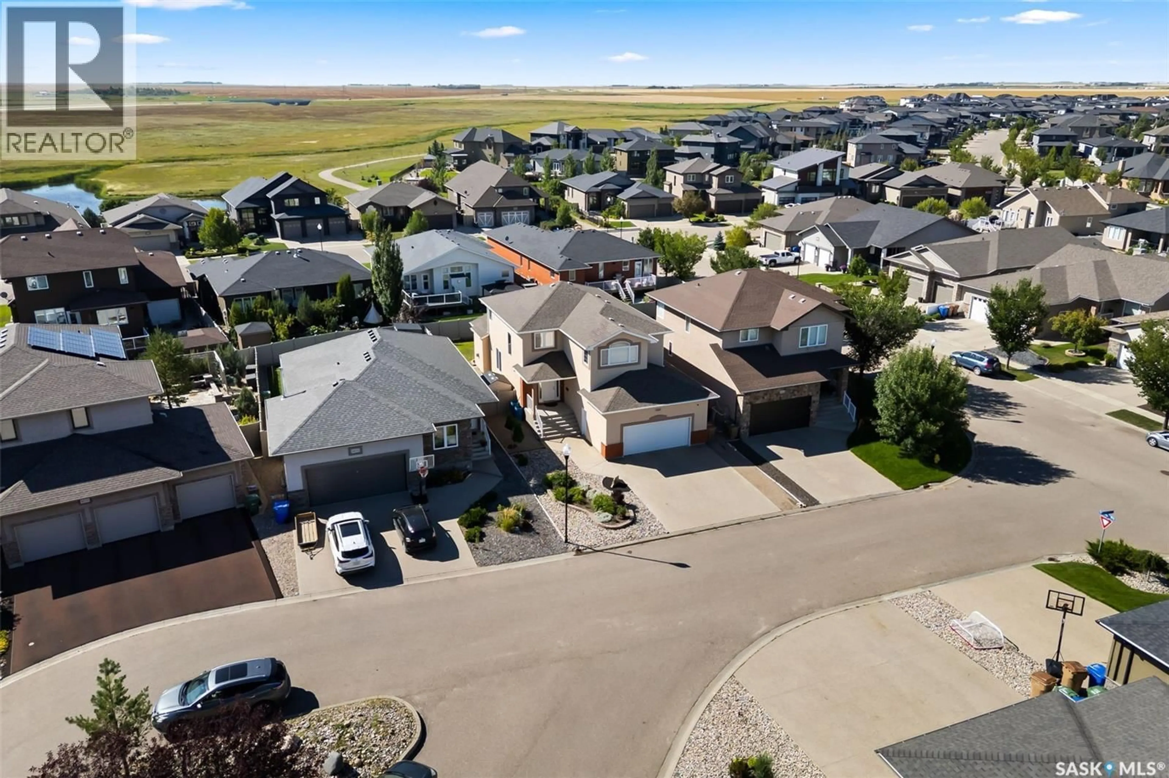 A pic from outside/outdoor area/front of a property/back of a property/a pic from drone, street for E - 4638 PINCHERRY PLACE, Regina Saskatchewan S4V1N1