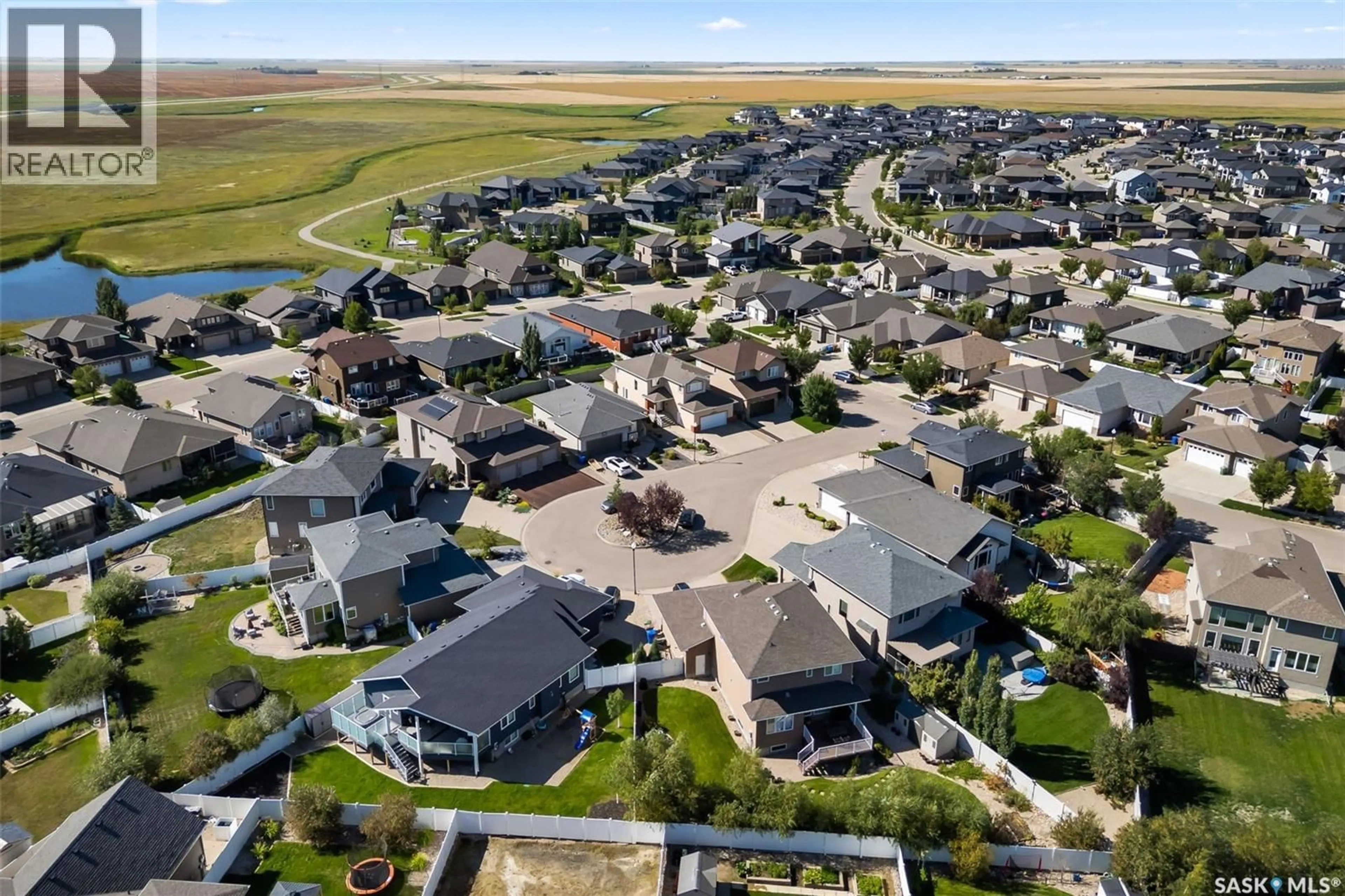 A pic from outside/outdoor area/front of a property/back of a property/a pic from drone, street for E - 4638 PINCHERRY PLACE, Regina Saskatchewan S4V1N1