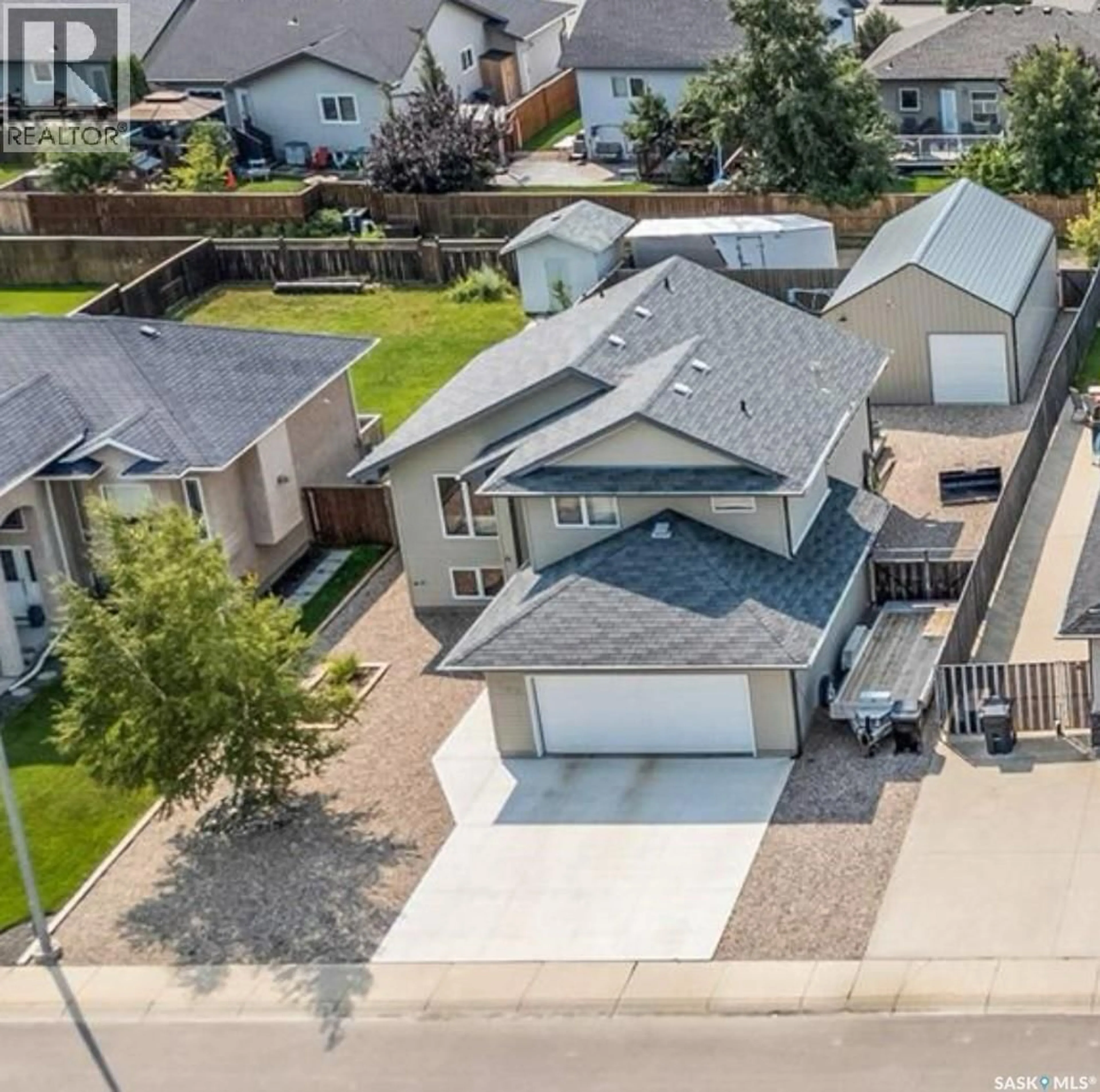 A pic from outside/outdoor area/front of a property/back of a property/a pic from drone, street for 804 ROCK HILL LANE, Martensville Saskatchewan S0K0A2