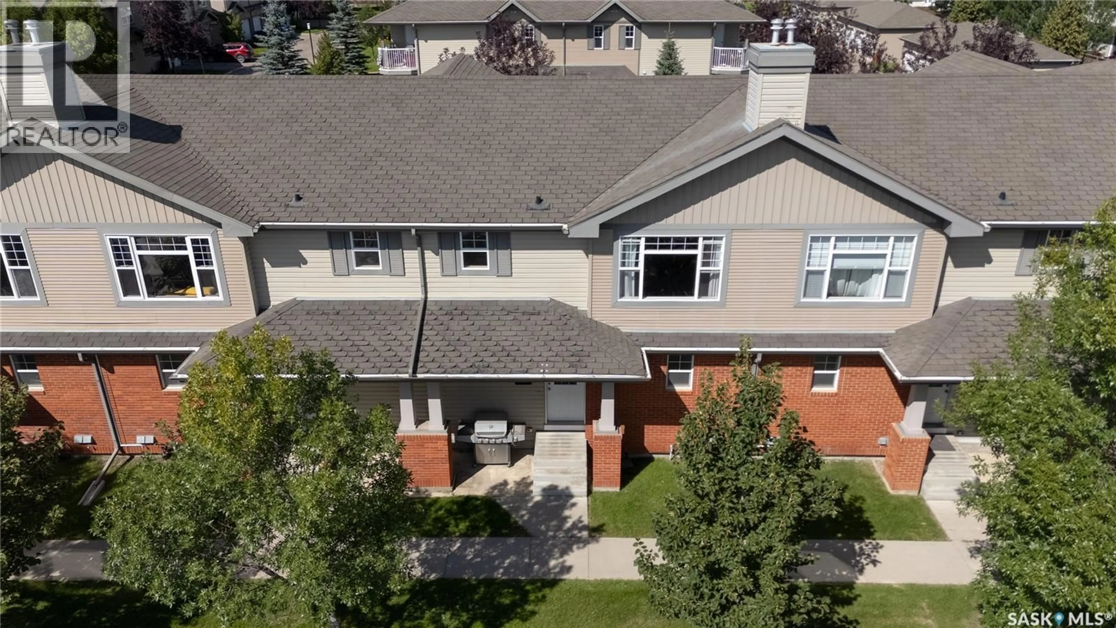 A pic from outside/outdoor area/front of a property/back of a property/a pic from drone, unknown for 410 - 121 STENSRUD ROAD, Saskatoon Saskatchewan S7W0B7