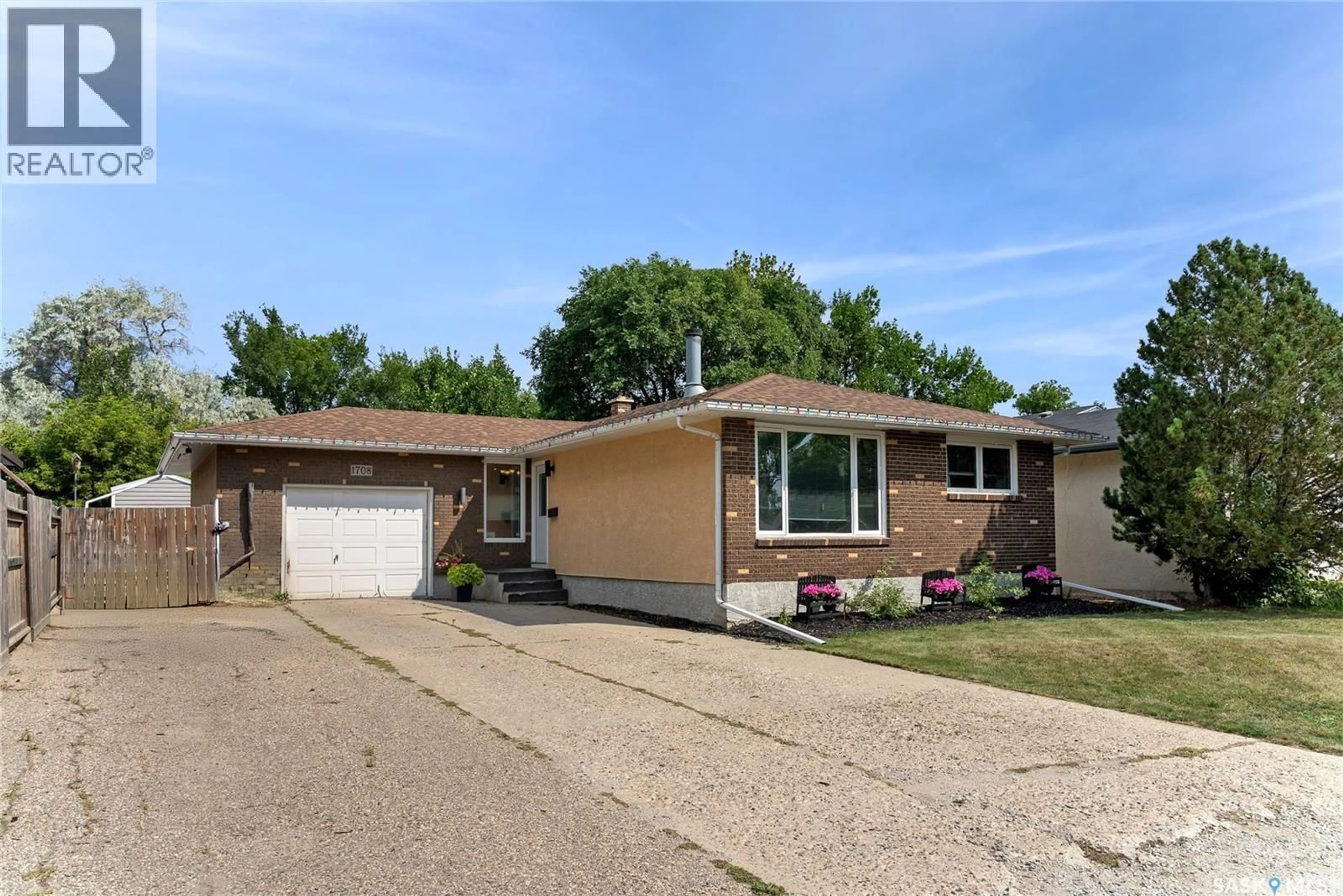 Home with vinyl exterior material, street for 1708 12TH AVENUE, Regina Saskatchewan S4R6Y6