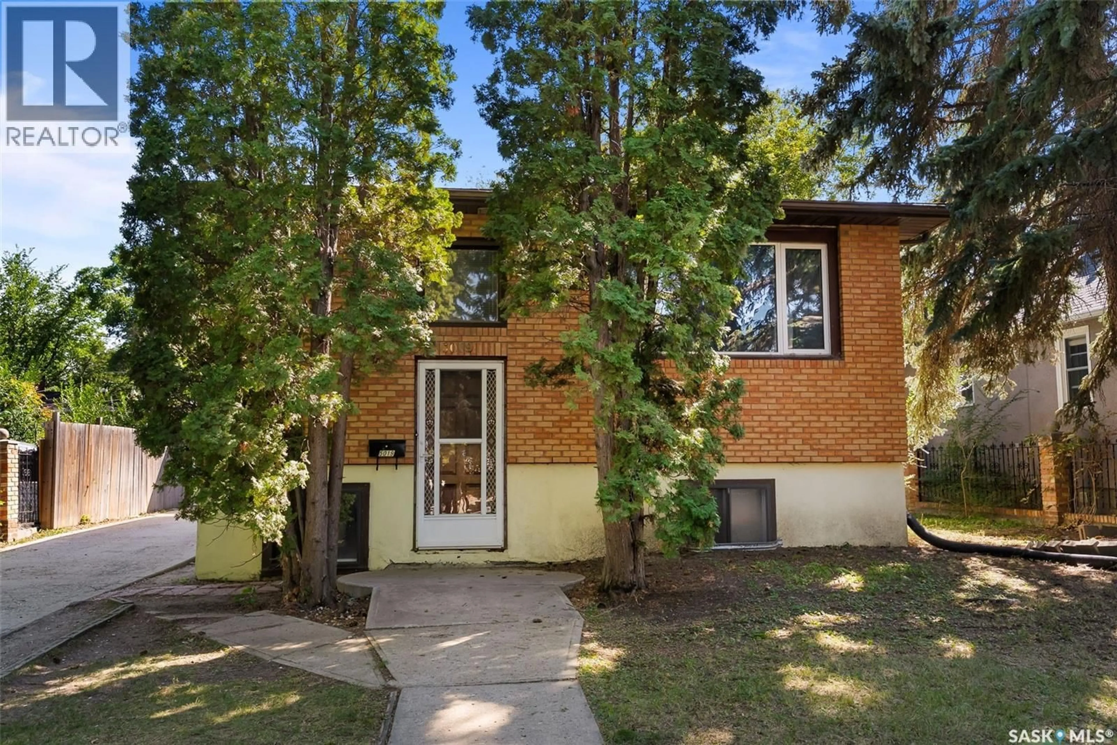Home with brick exterior material, street for 5019 8TH AVENUE, Regina Saskatchewan S4T0W4