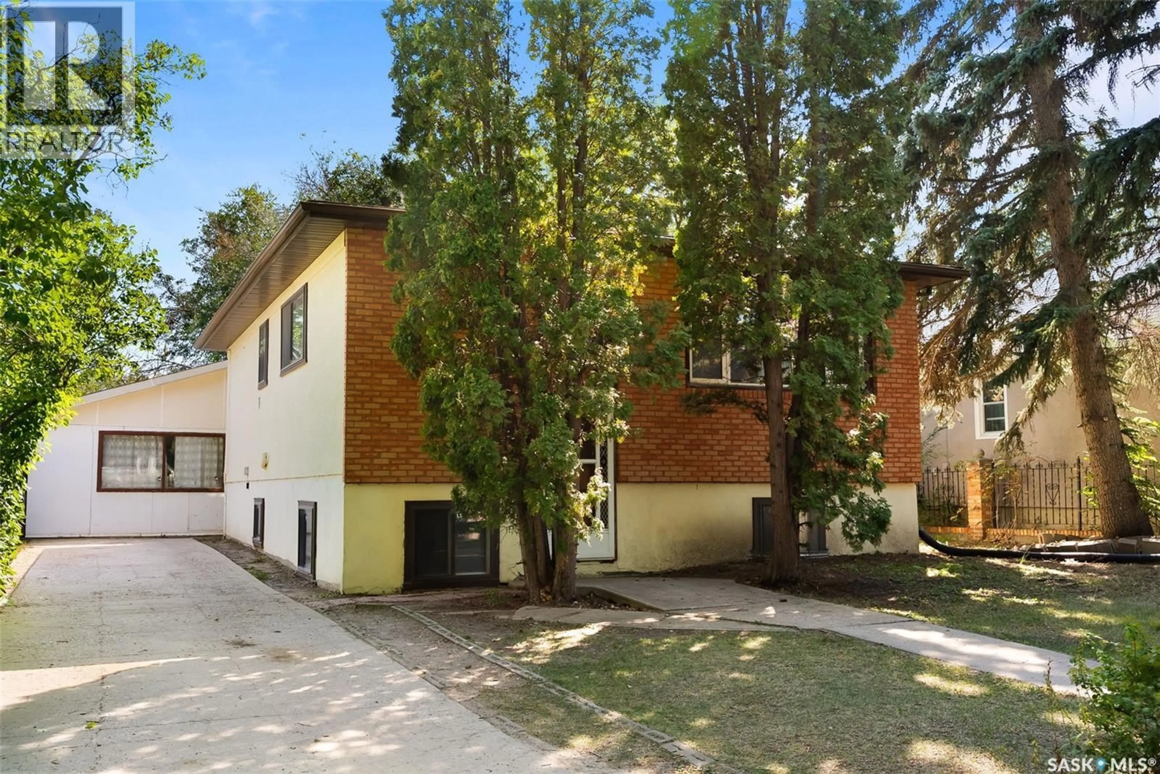 Home with brick exterior material, street for 5019 8TH AVENUE, Regina Saskatchewan S4T0W4