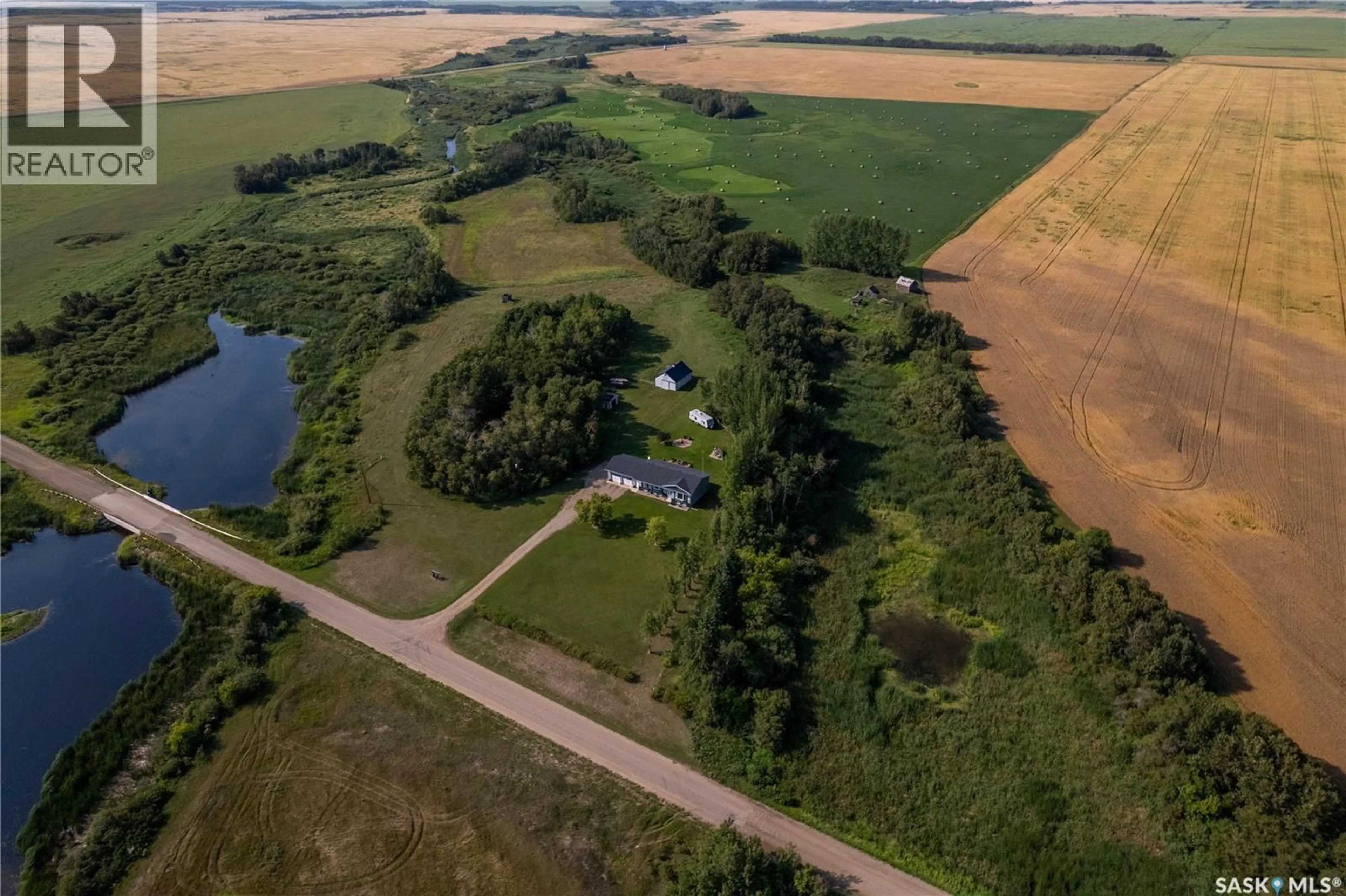 A pic from outside/outdoor area/front of a property/back of a property/a pic from drone, water/lake/river/ocean view for CLARK ACREAGE, Spy Hill Rm No. 152 Saskatchewan S0A3W0