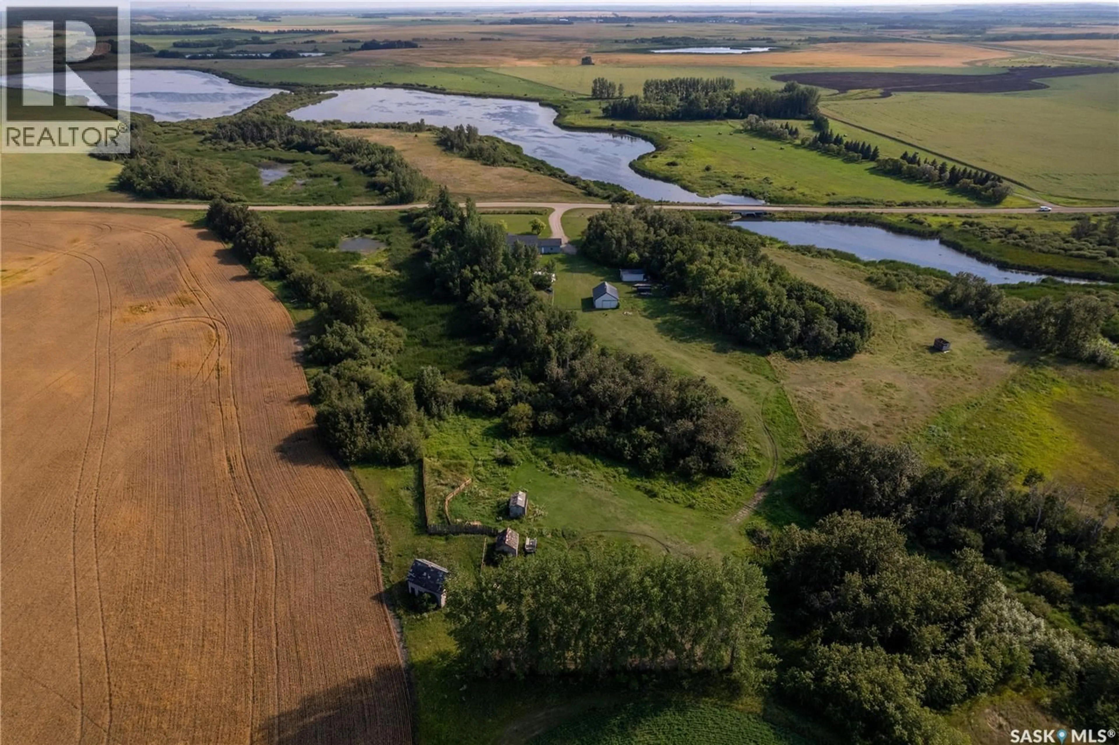 A pic from outside/outdoor area/front of a property/back of a property/a pic from drone, water/lake/river/ocean view for CLARK ACREAGE, Spy Hill Rm No. 152 Saskatchewan S0A3W0