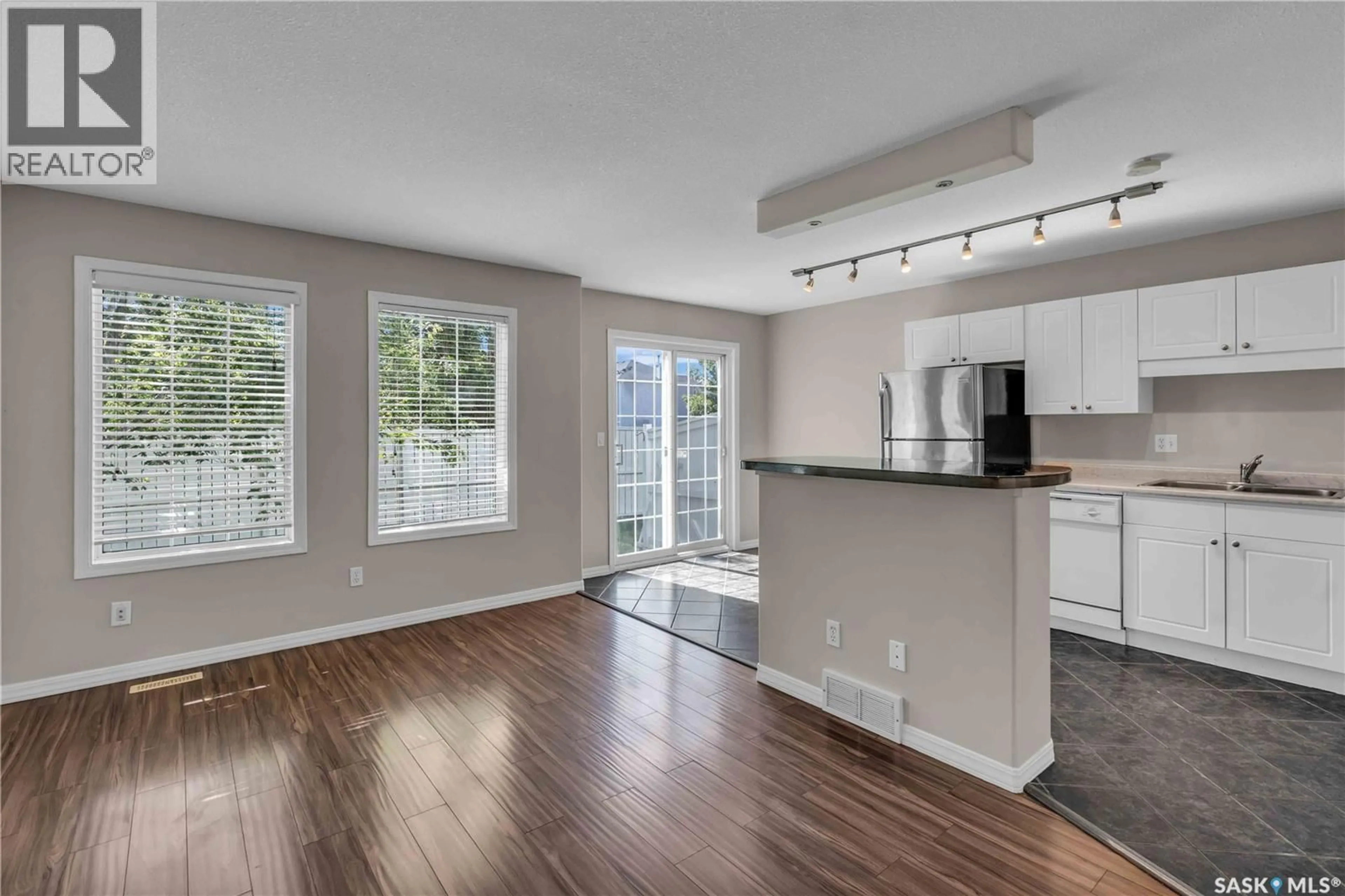 Open concept kitchen, wood/laminate floor for 13 110 KEEVIL CRESCENT, Saskatoon Saskatchewan S7N4N8