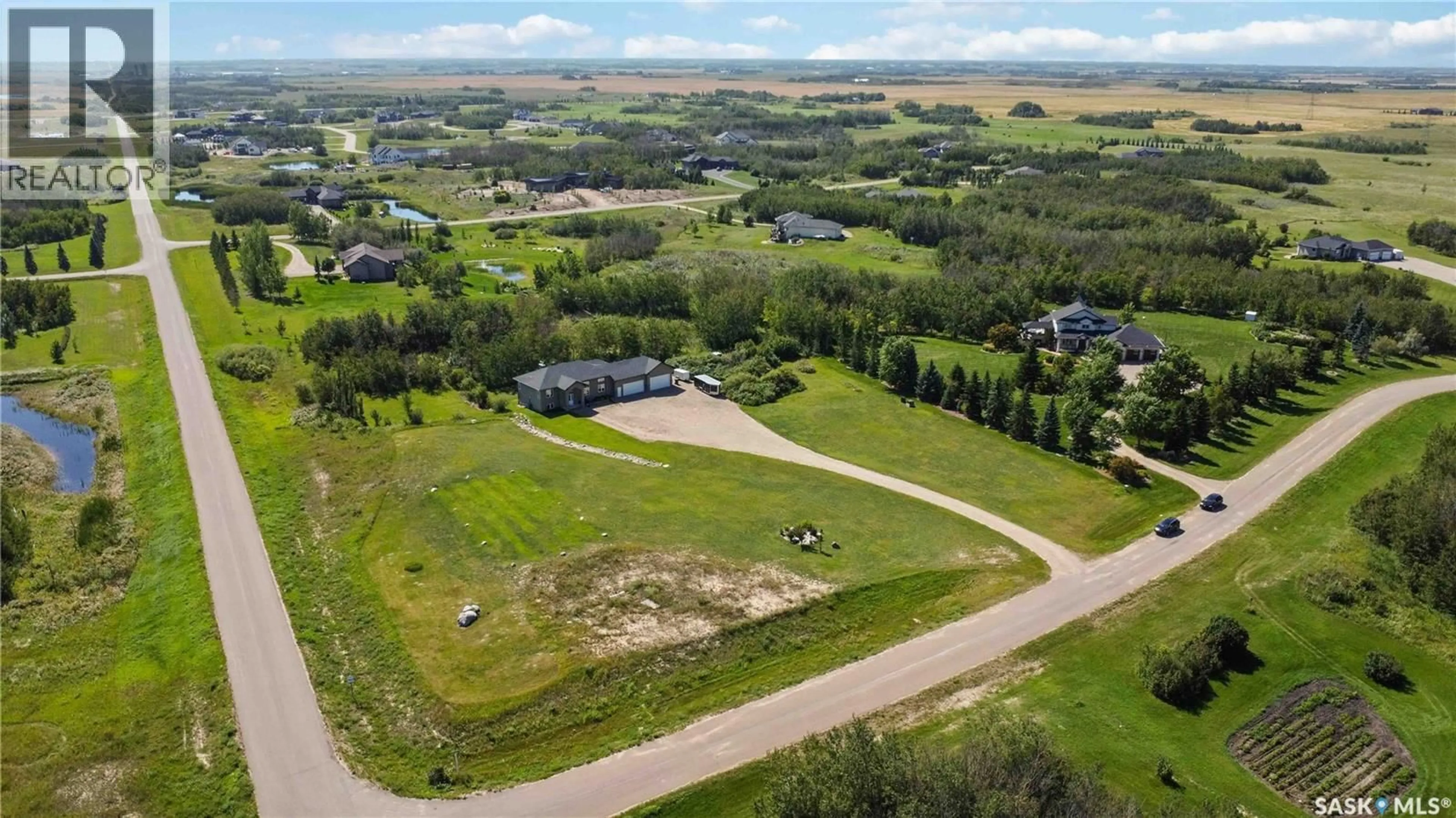 A pic from outside/outdoor area/front of a property/back of a property/a pic from drone, unknown for 26 HIDDEN RIDGE BEND, Corman Park Rm No. 344 Saskatchewan S0K0Y0