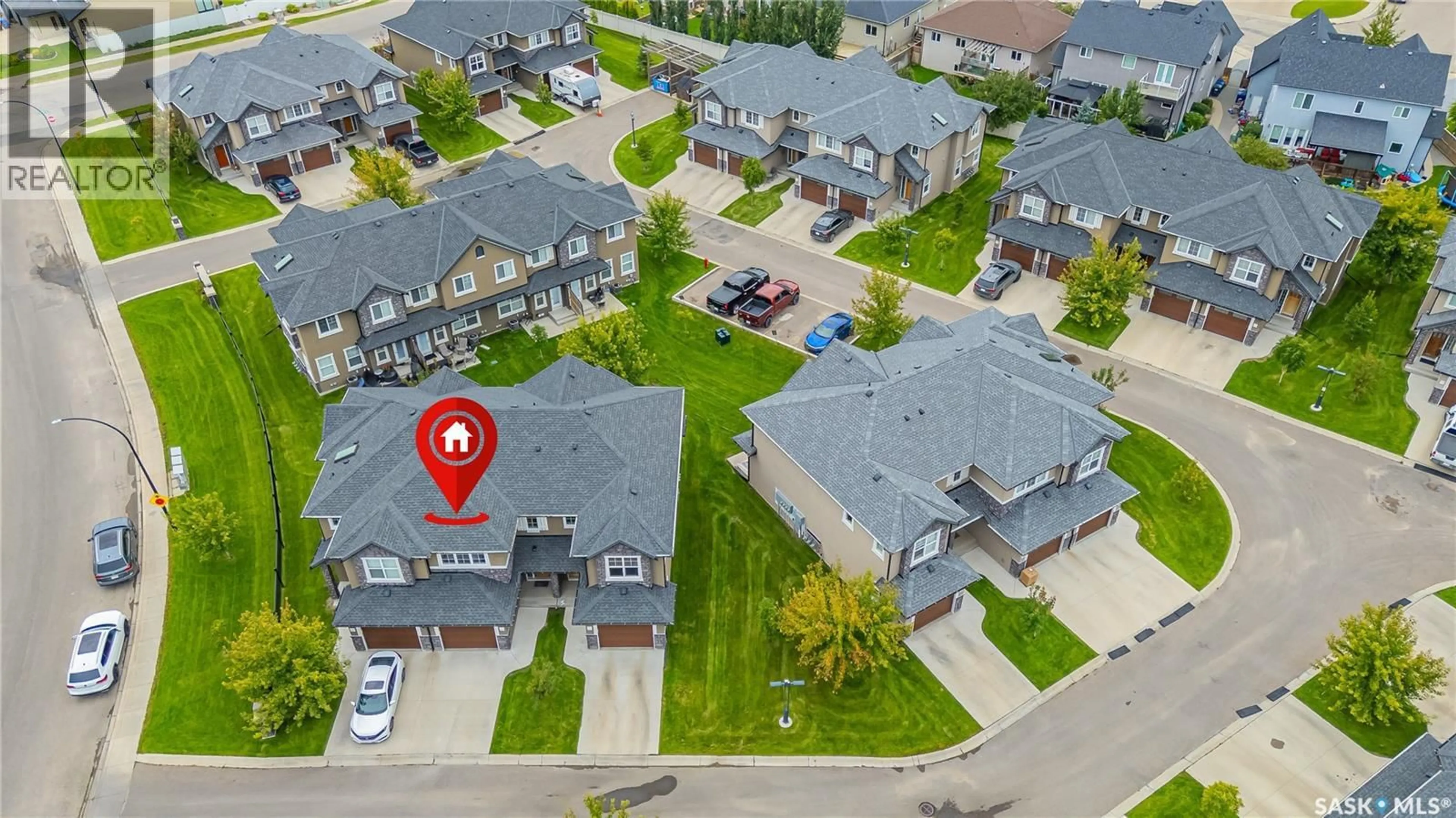 A pic from outside/outdoor area/front of a property/back of a property/a pic from drone, street for 405 - 1555 PATON CRESCENT, Saskatoon Saskatchewan S7W0V5