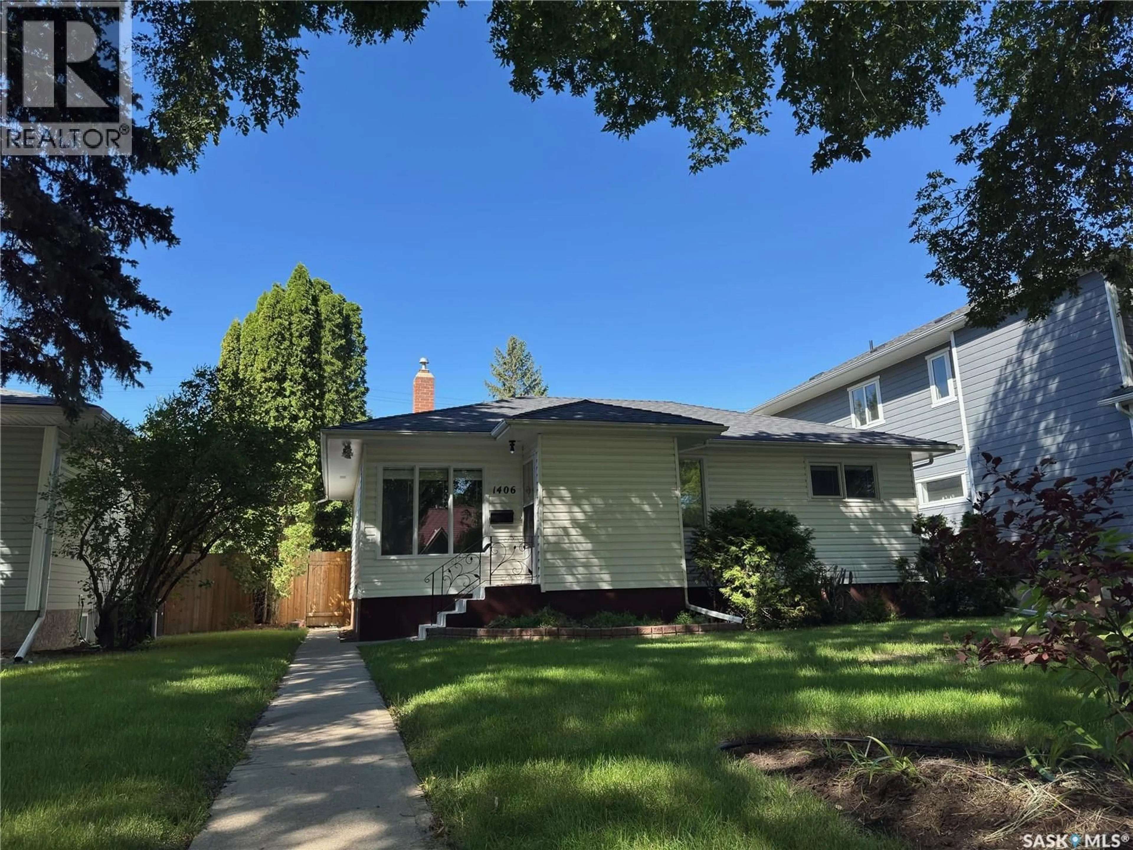 Home with vinyl exterior material, street for S - 1406 WIGGINS AVENUE, Saskatoon Saskatchewan S7H2J6