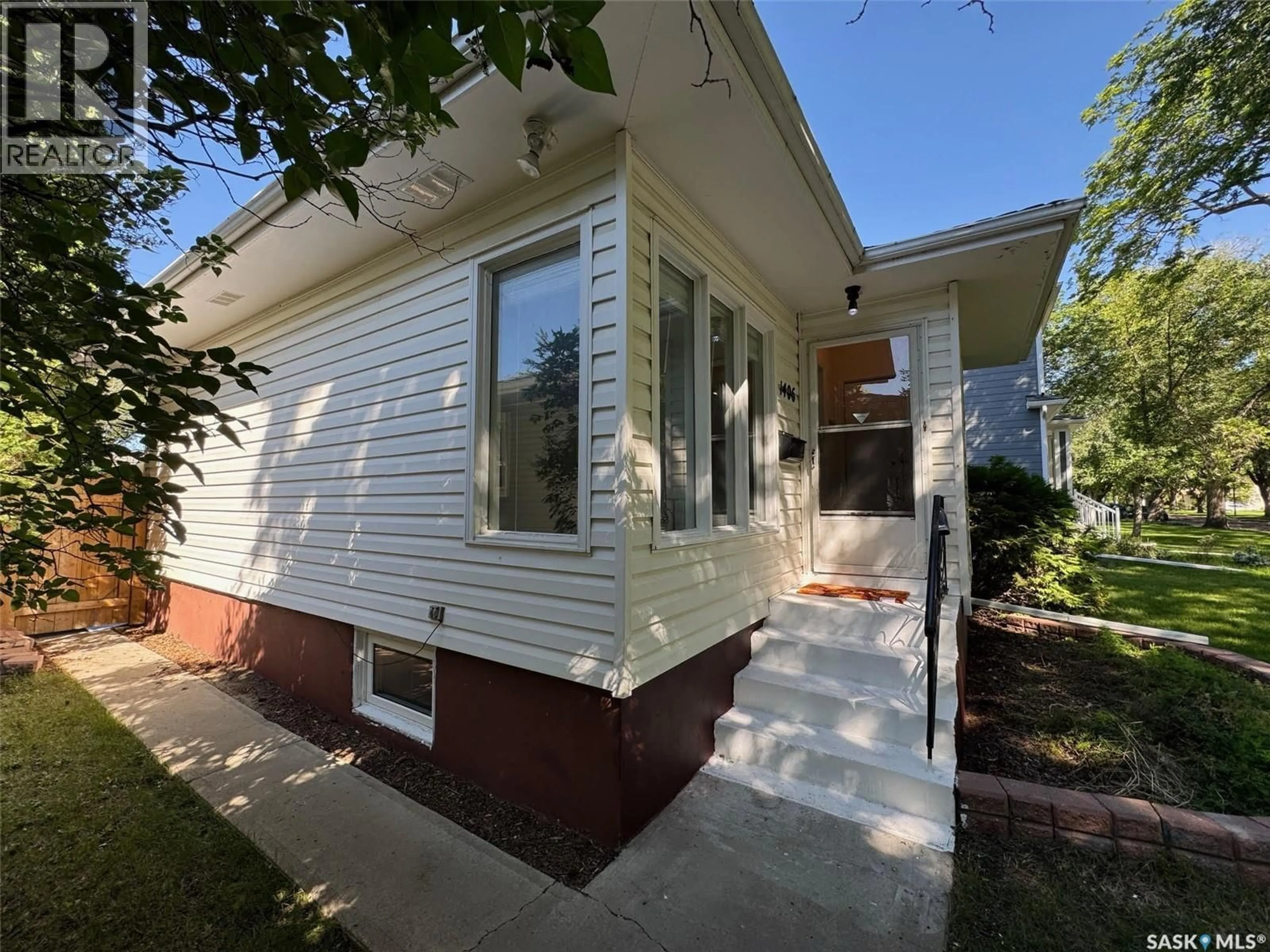 Home with vinyl exterior material, street for S - 1406 WIGGINS AVENUE, Saskatoon Saskatchewan S7H2J6