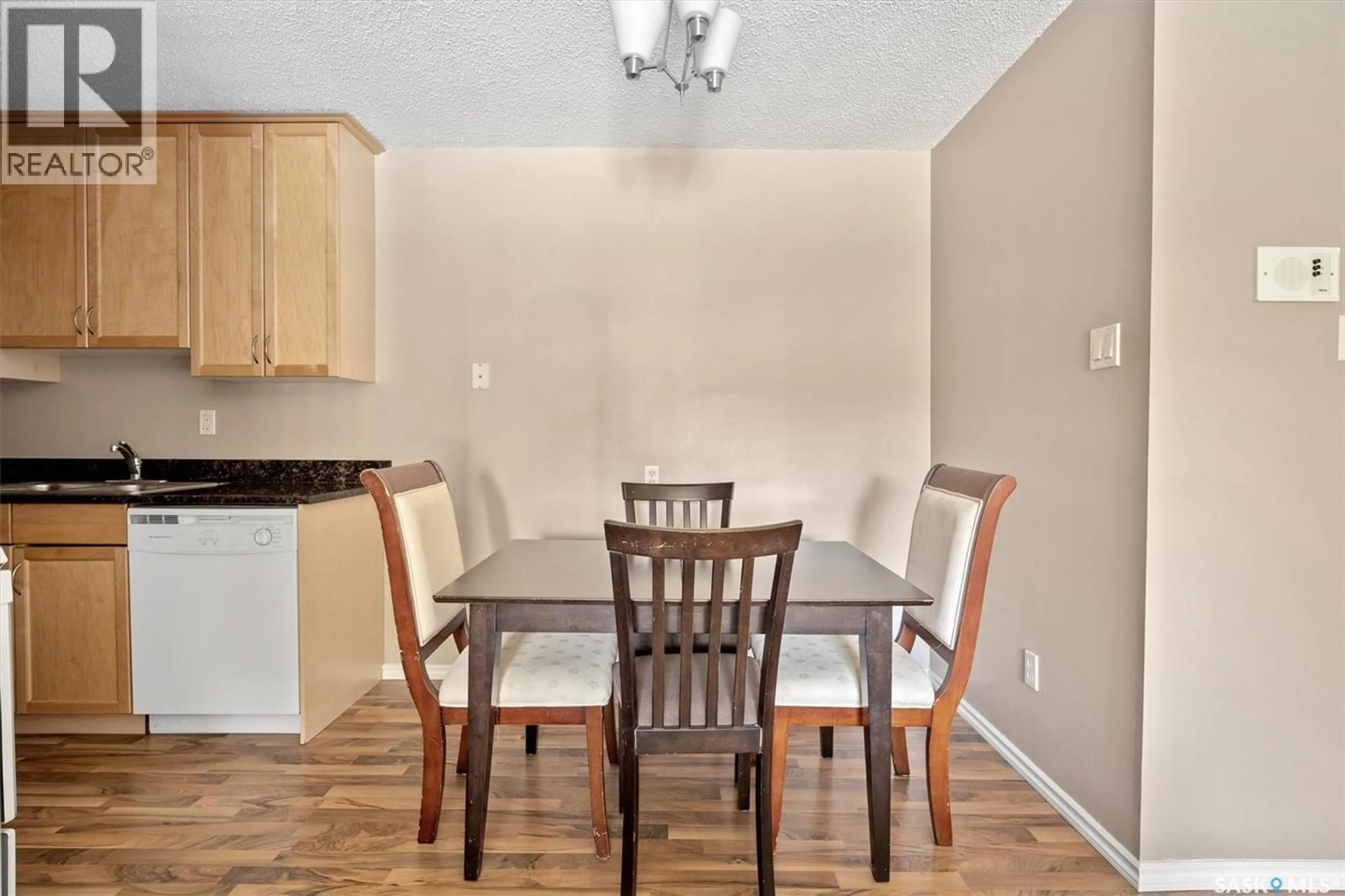 Dining room, wood/laminate floor for 102c - 1121 MCKERCHER DRIVE, Saskatoon Saskatchewan S7H5B8