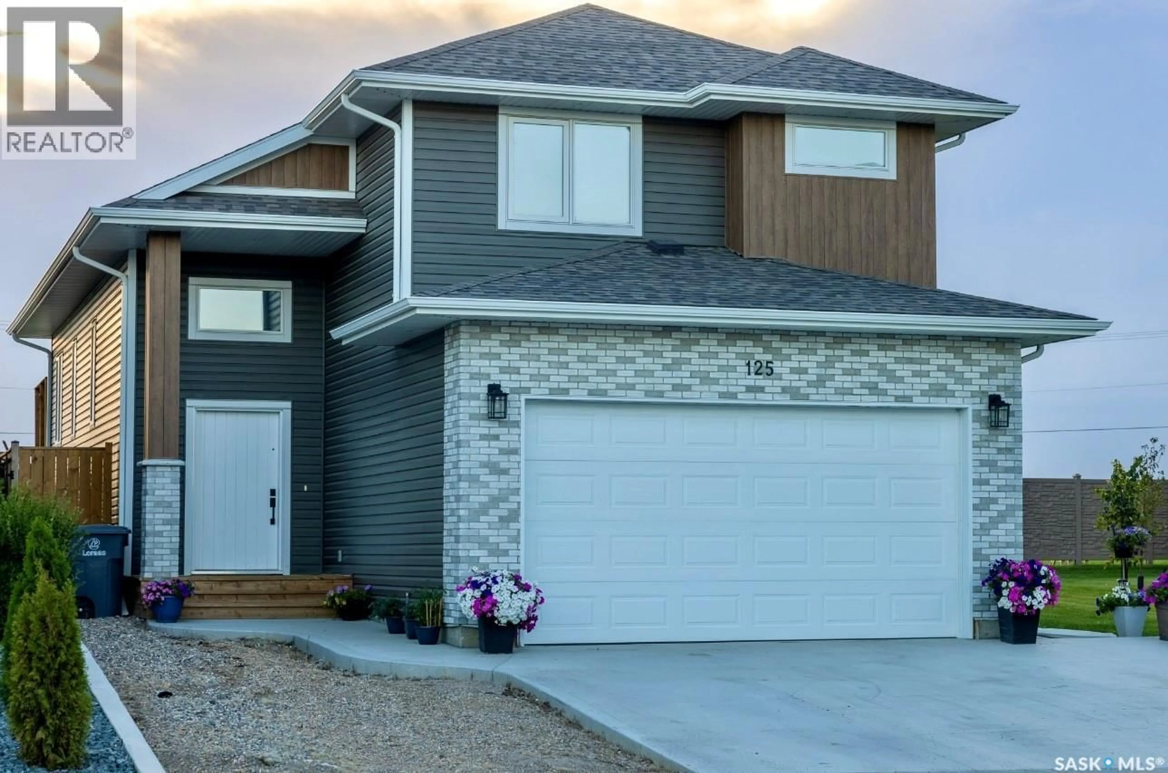 Home with vinyl exterior material, street for 125 BEAUDRY CRESCENT, Martensville Saskatchewan S0K2T1