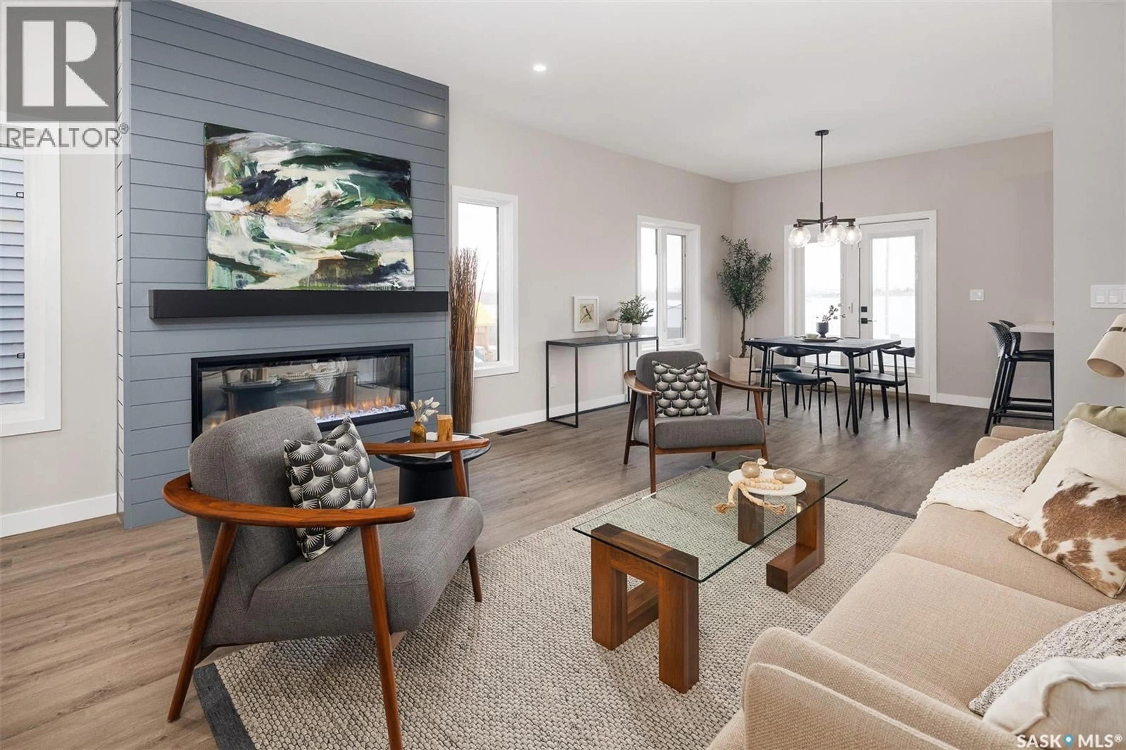Living room with furniture, wood/laminate floor for 125 BEAUDRY CRESCENT, Martensville Saskatchewan S0K2T1