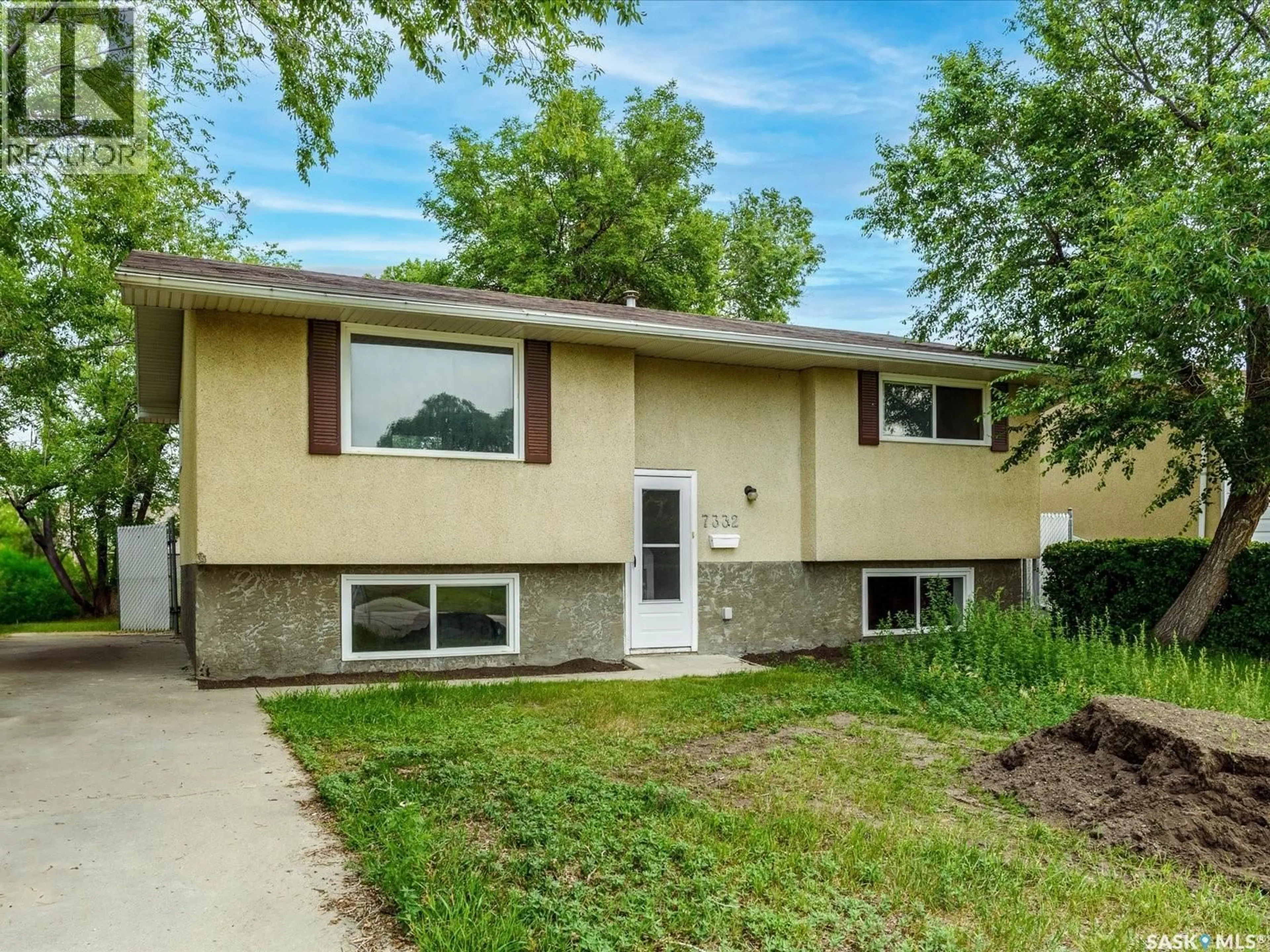 Home with vinyl exterior material, street for 7332 BOWMAN AVENUE, Regina Saskatchewan S4T6K8