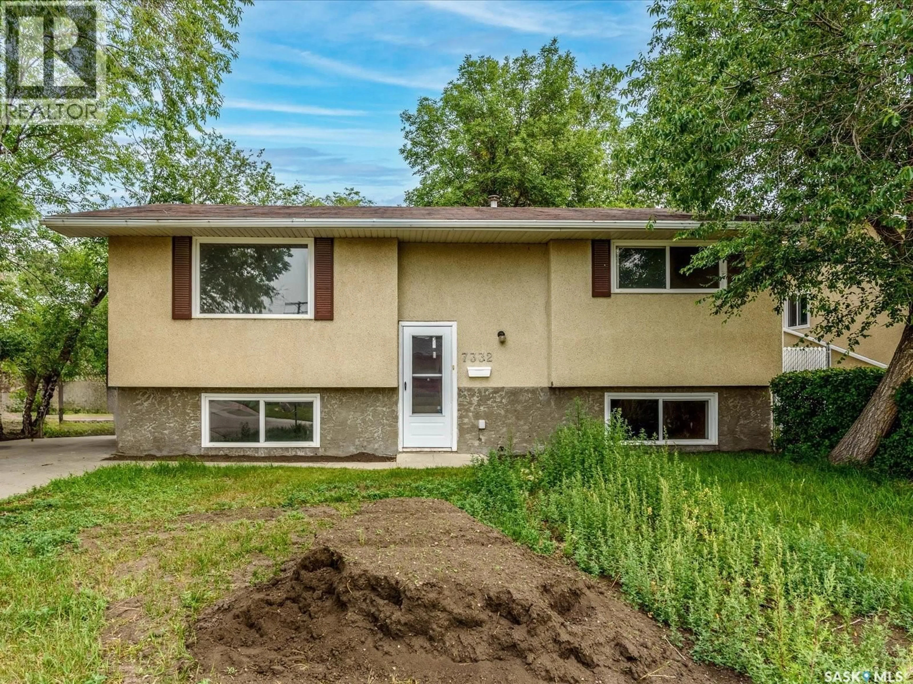 Home with vinyl exterior material, street for 7332 BOWMAN AVENUE, Regina Saskatchewan S4T6K8