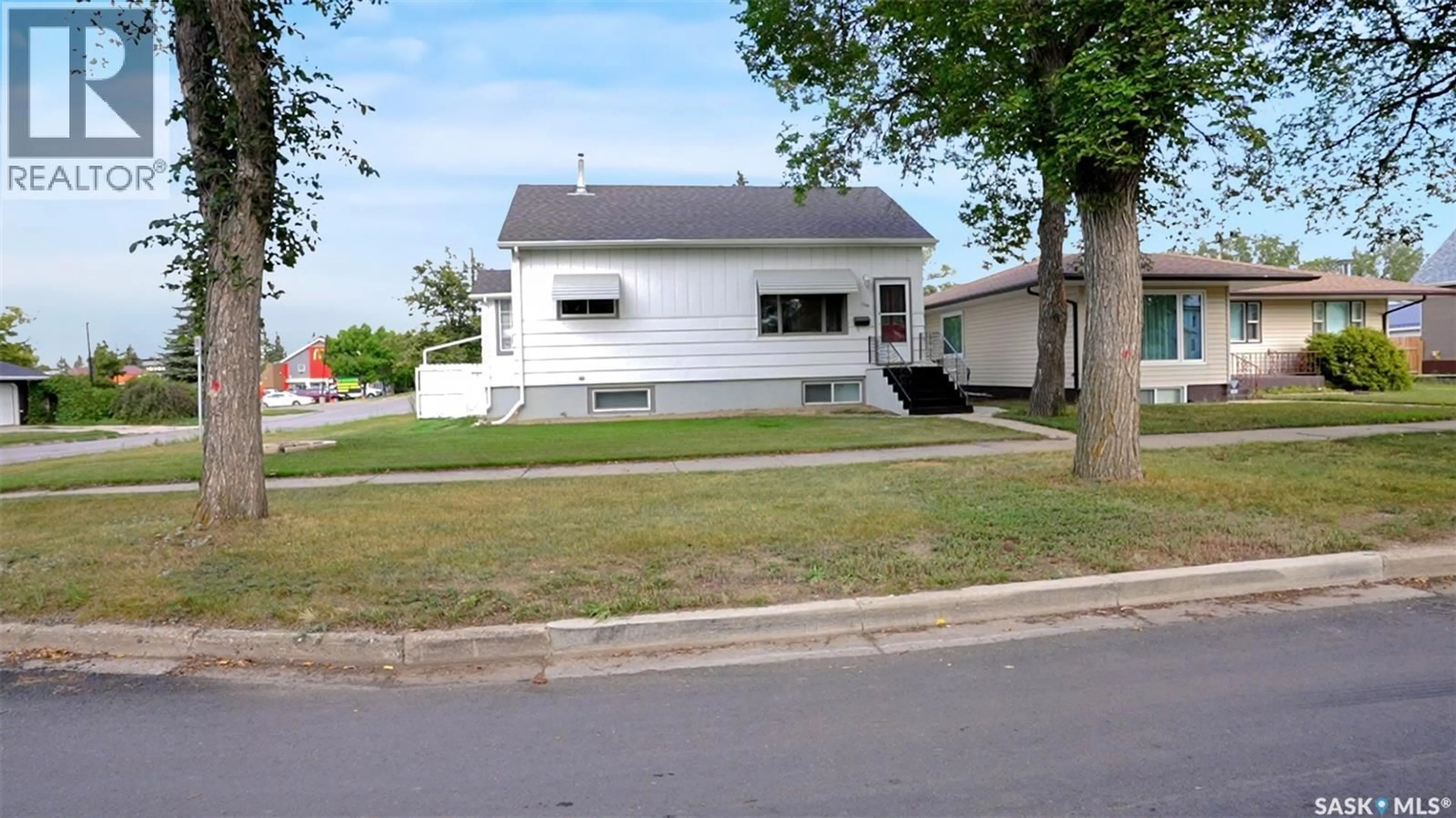 Home with vinyl exterior material, street for 1281 1ST AVENUE, Moose Jaw Saskatchewan S6H3N5