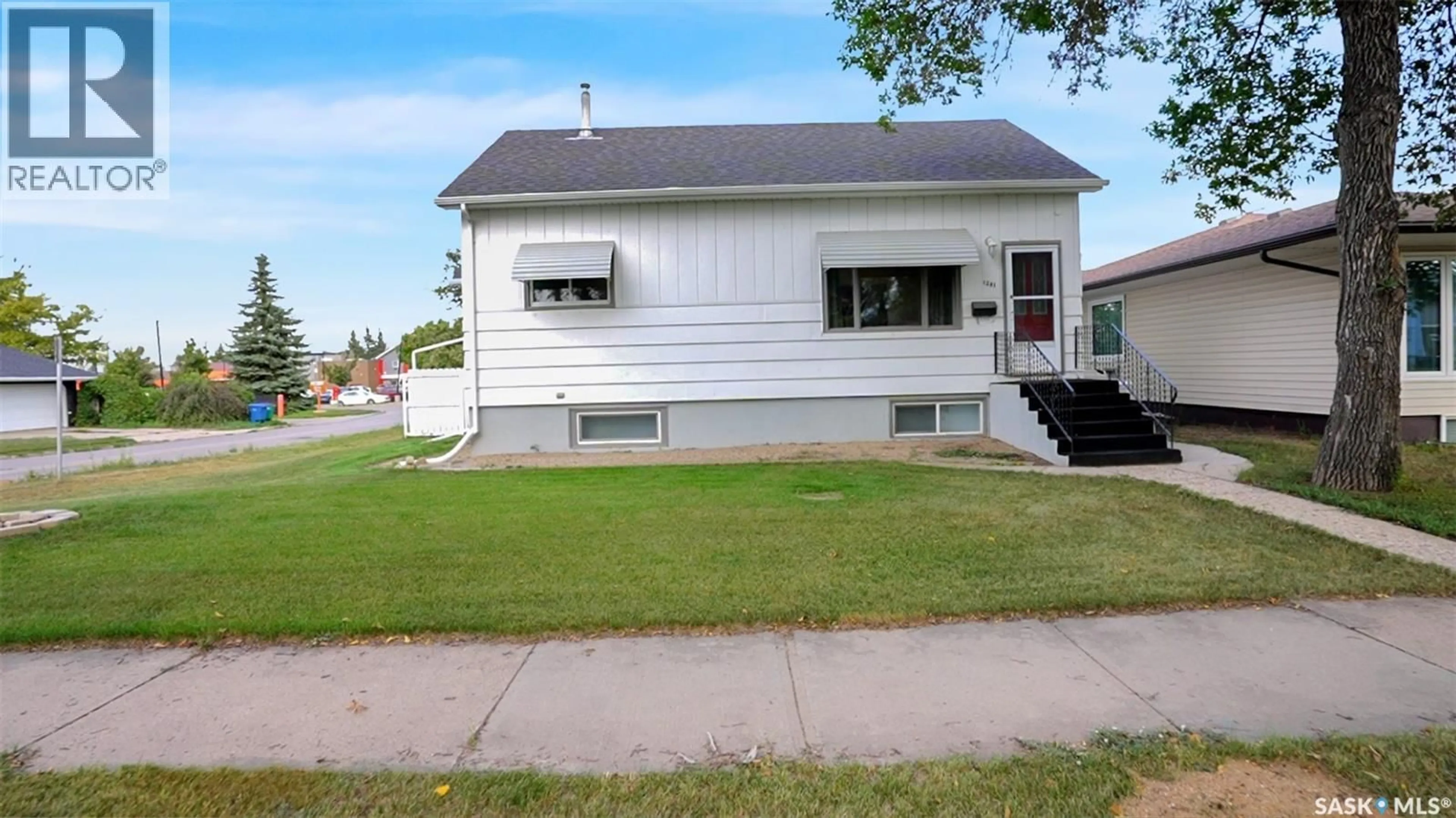 Home with vinyl exterior material, street for 1281 1ST AVENUE, Moose Jaw Saskatchewan S6H3N5