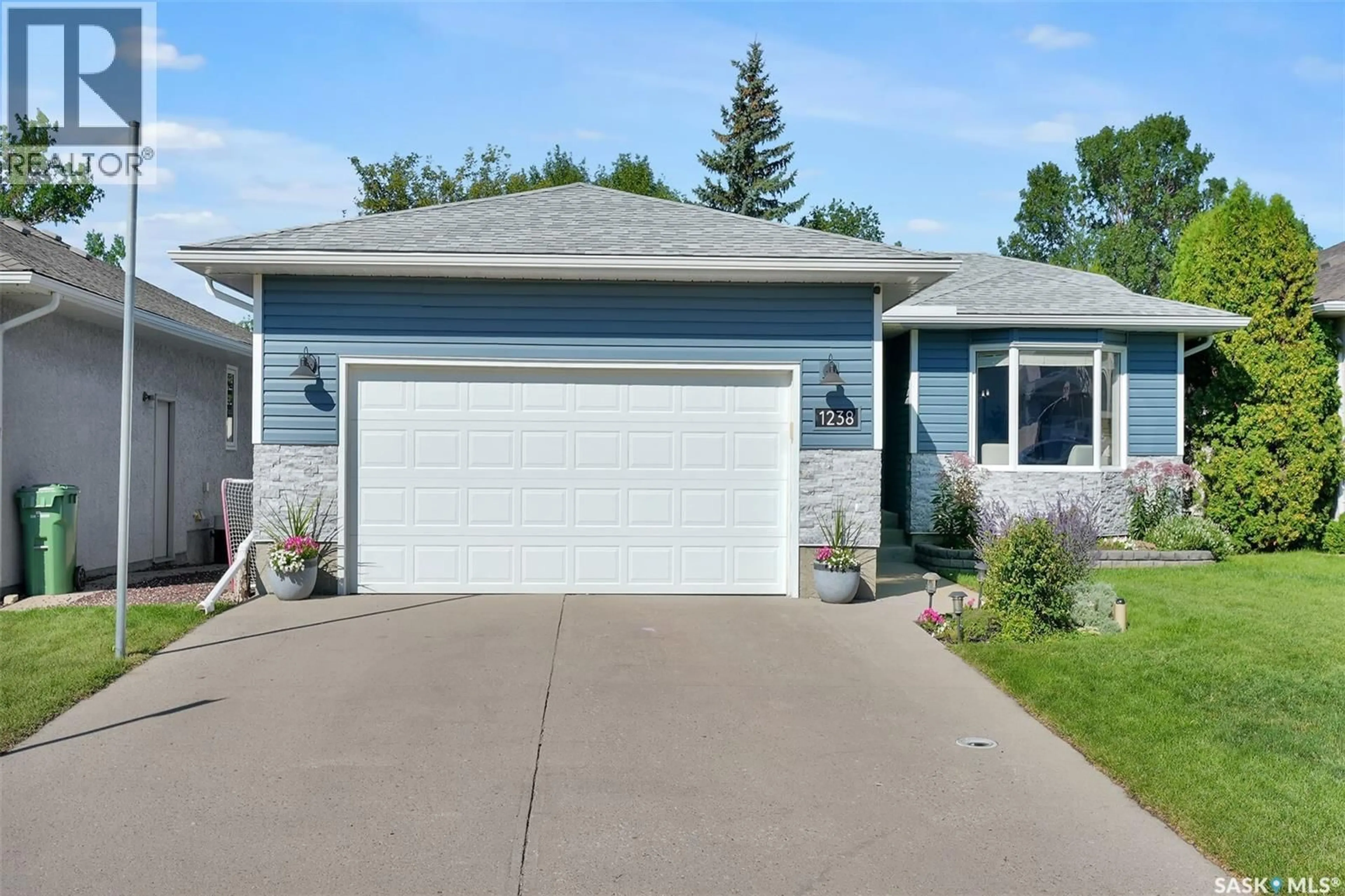 Home with vinyl exterior material, street for 1238 GELSINGER PLACE, Regina Saskatchewan S4X4K2