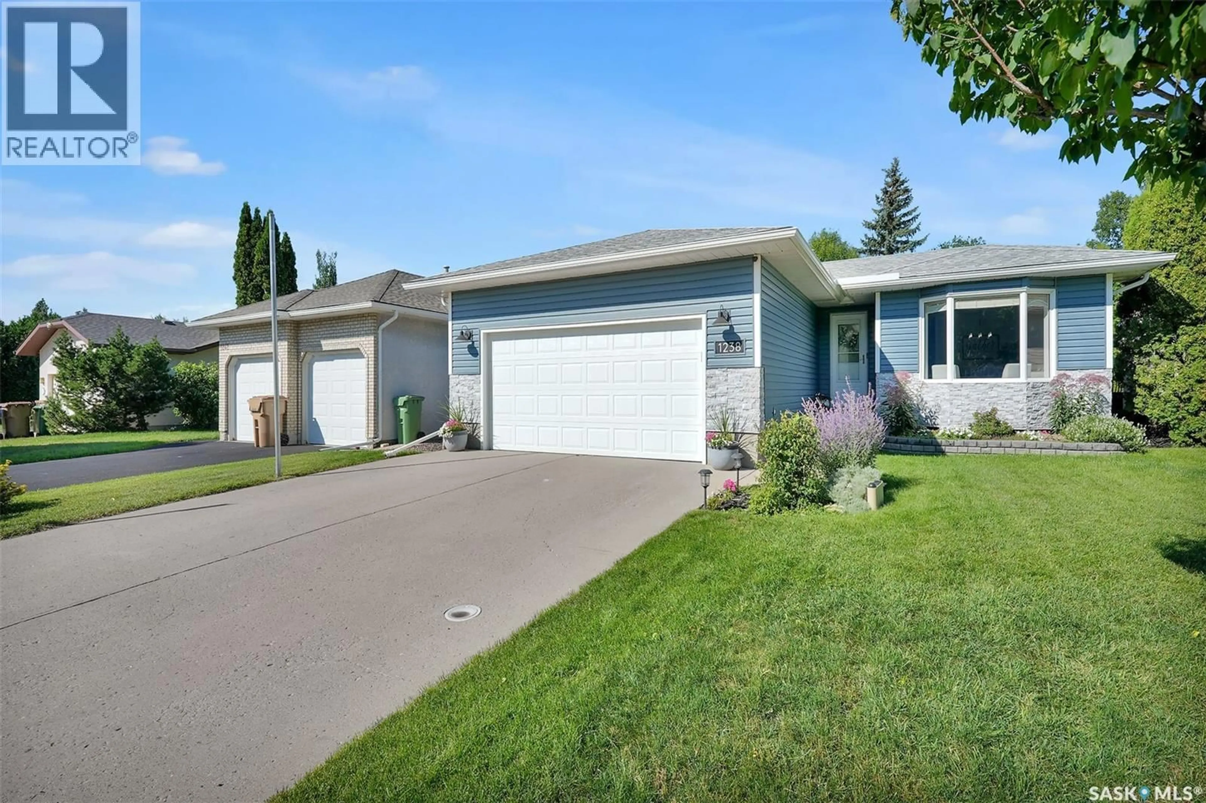 Home with vinyl exterior material, street for 1238 GELSINGER PLACE, Regina Saskatchewan S4X4K2