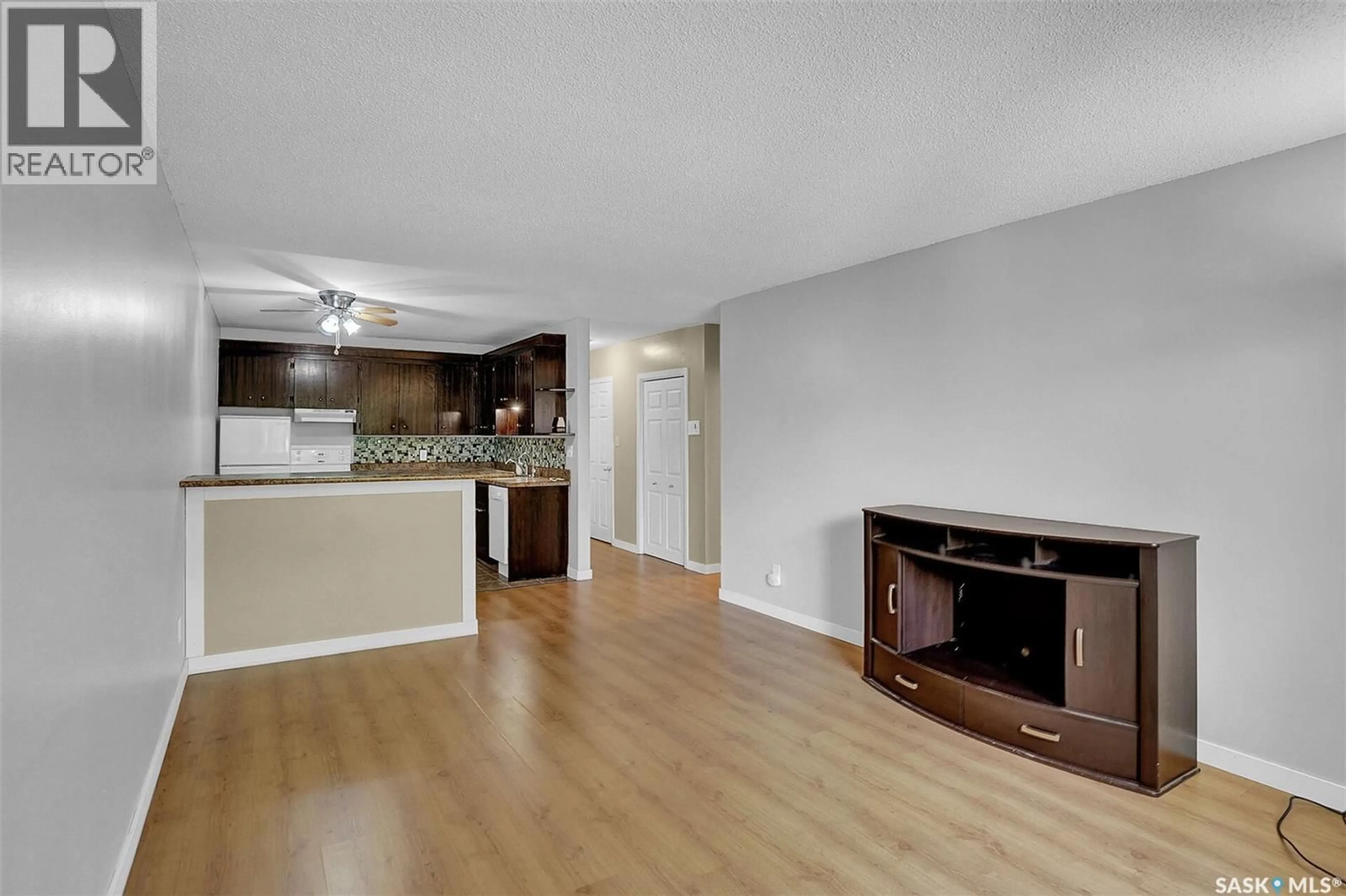 Living room with furniture, wood/laminate floor for 13 2358 RAE STREET, Regina Saskatchewan S4T2G2