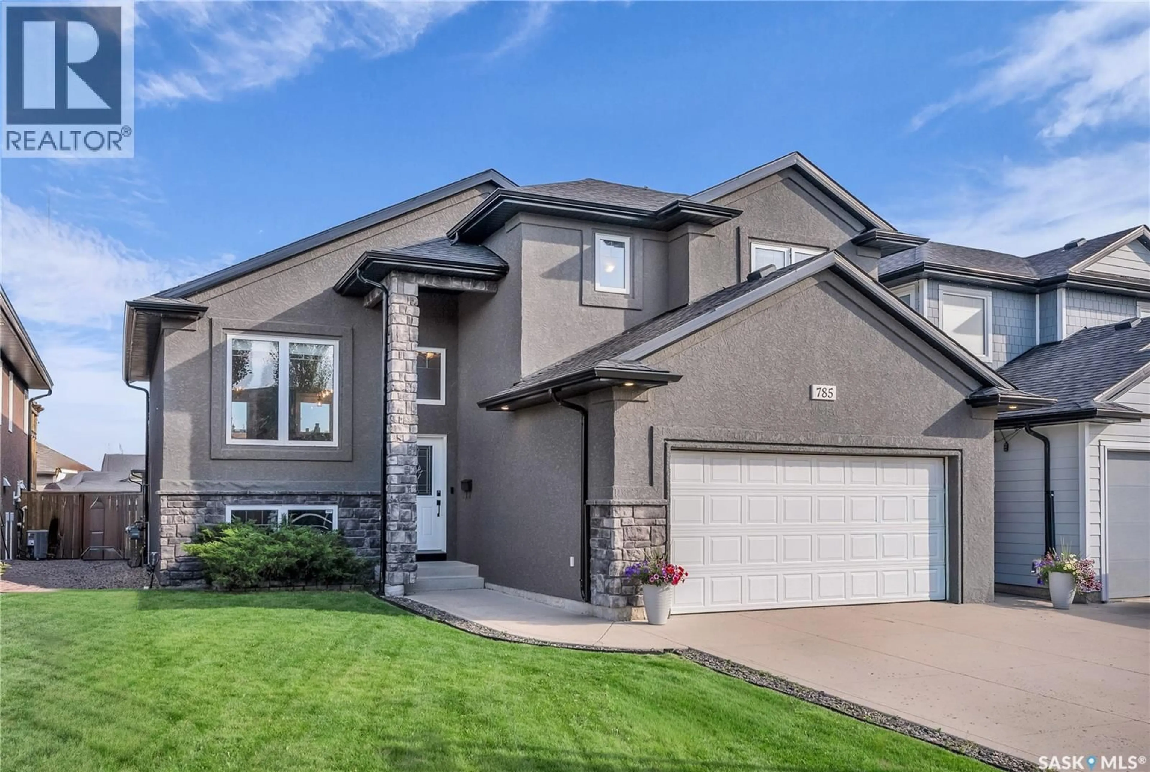 Home with vinyl exterior material, street for 785 REMPEL COVE, Saskatoon Saskatchewan S7T0M4