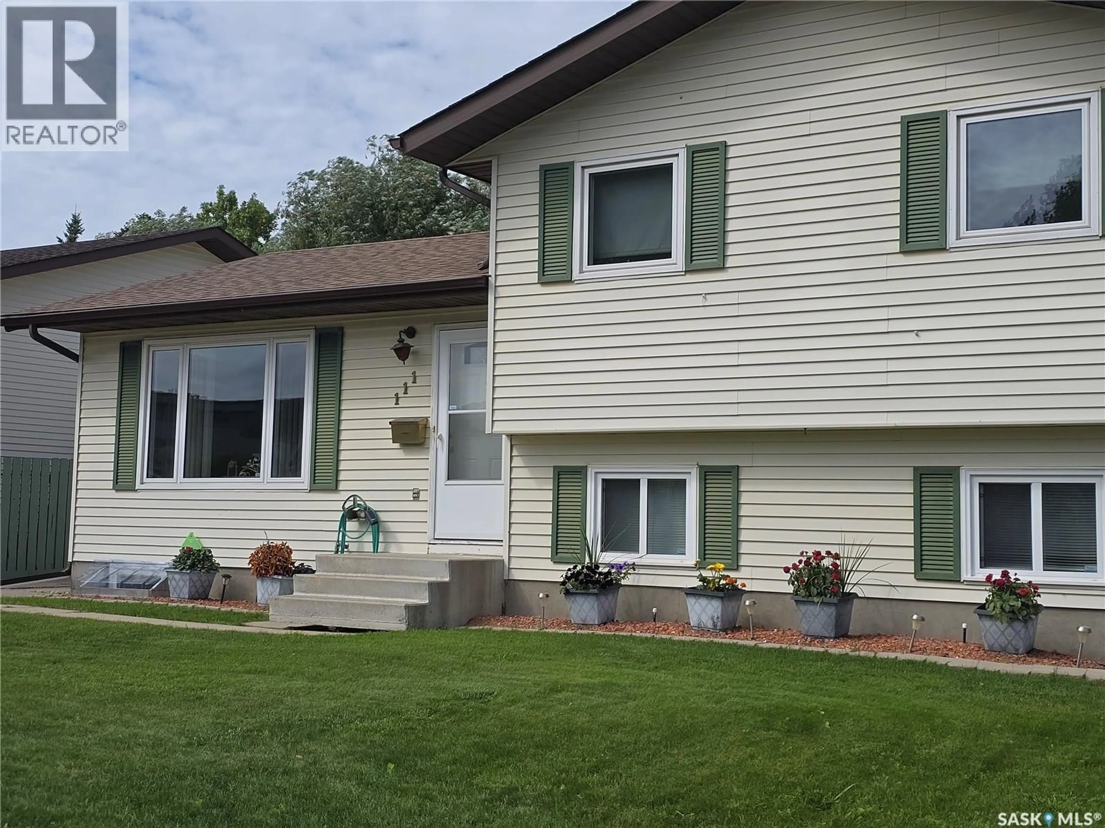 Home with vinyl exterior material, street for 111 O'REGAN CRESCENT, Saskatoon Saskatchewan S7L6P1