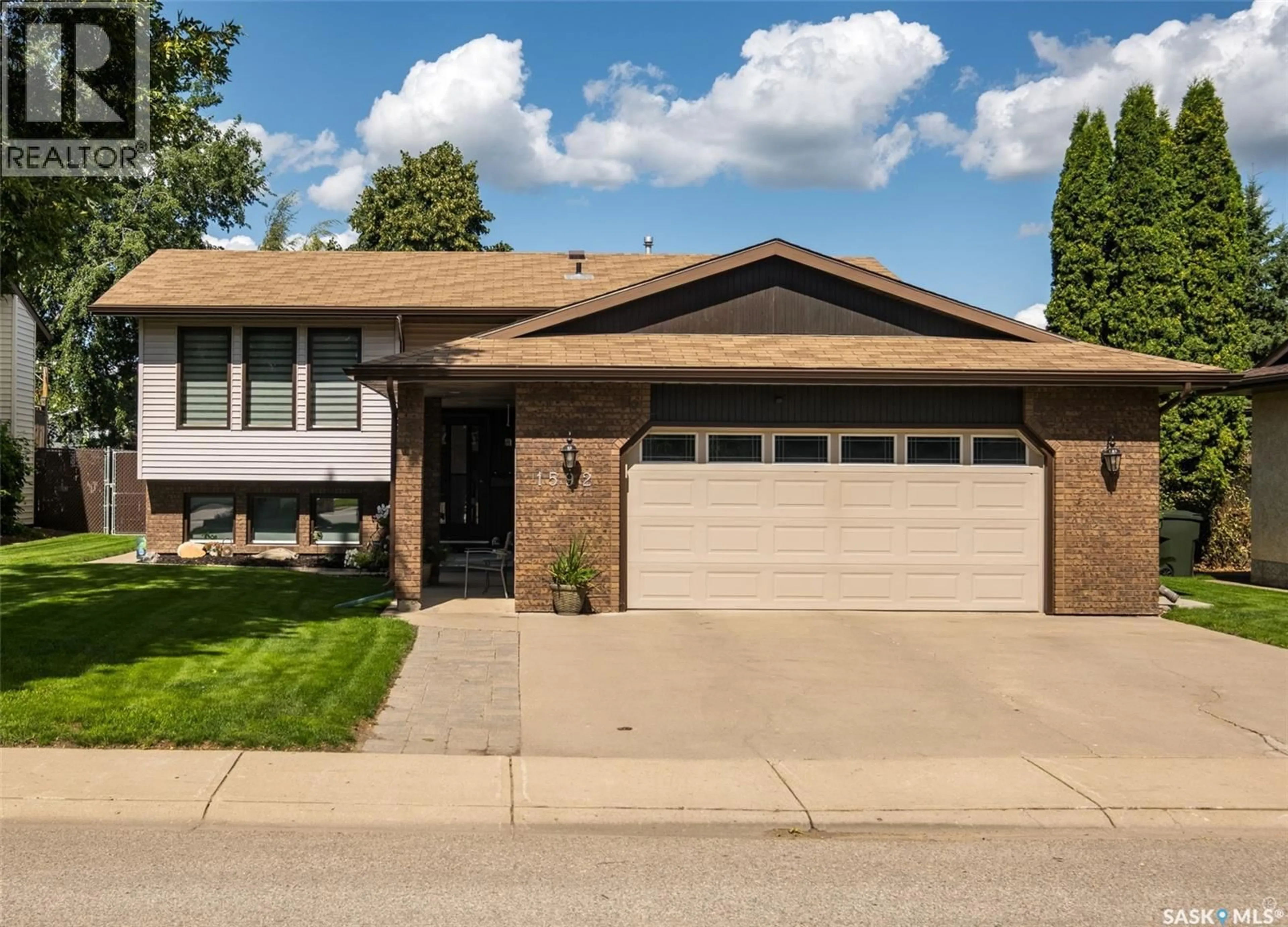 Home with vinyl exterior material, street for 1592 BARTON DRIVE, Prince Albert Saskatchewan S6V7W4