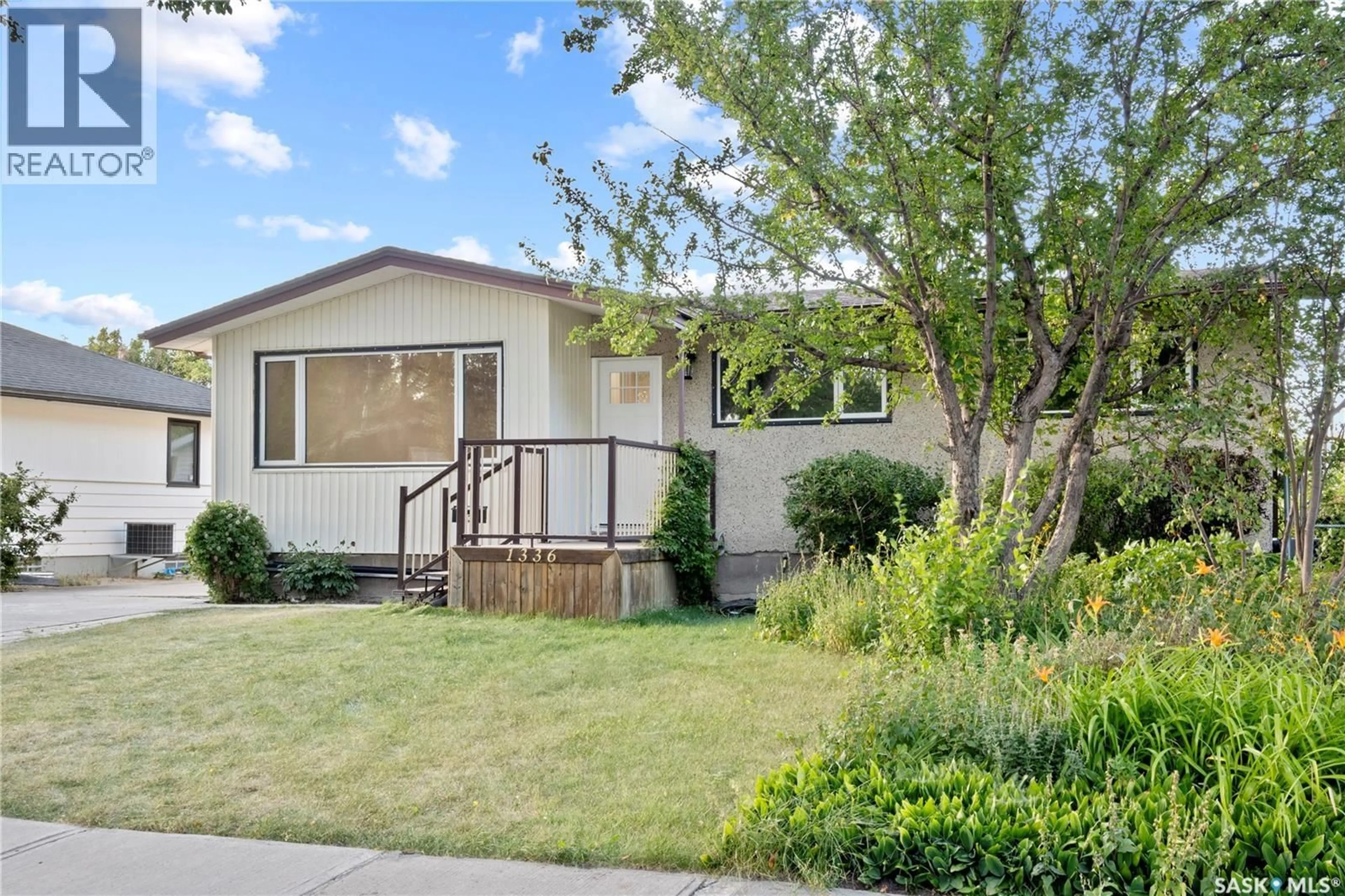 Home with vinyl exterior material, street for 1336 MCNIVEN AVENUE, Regina Saskatchewan S4S3X8