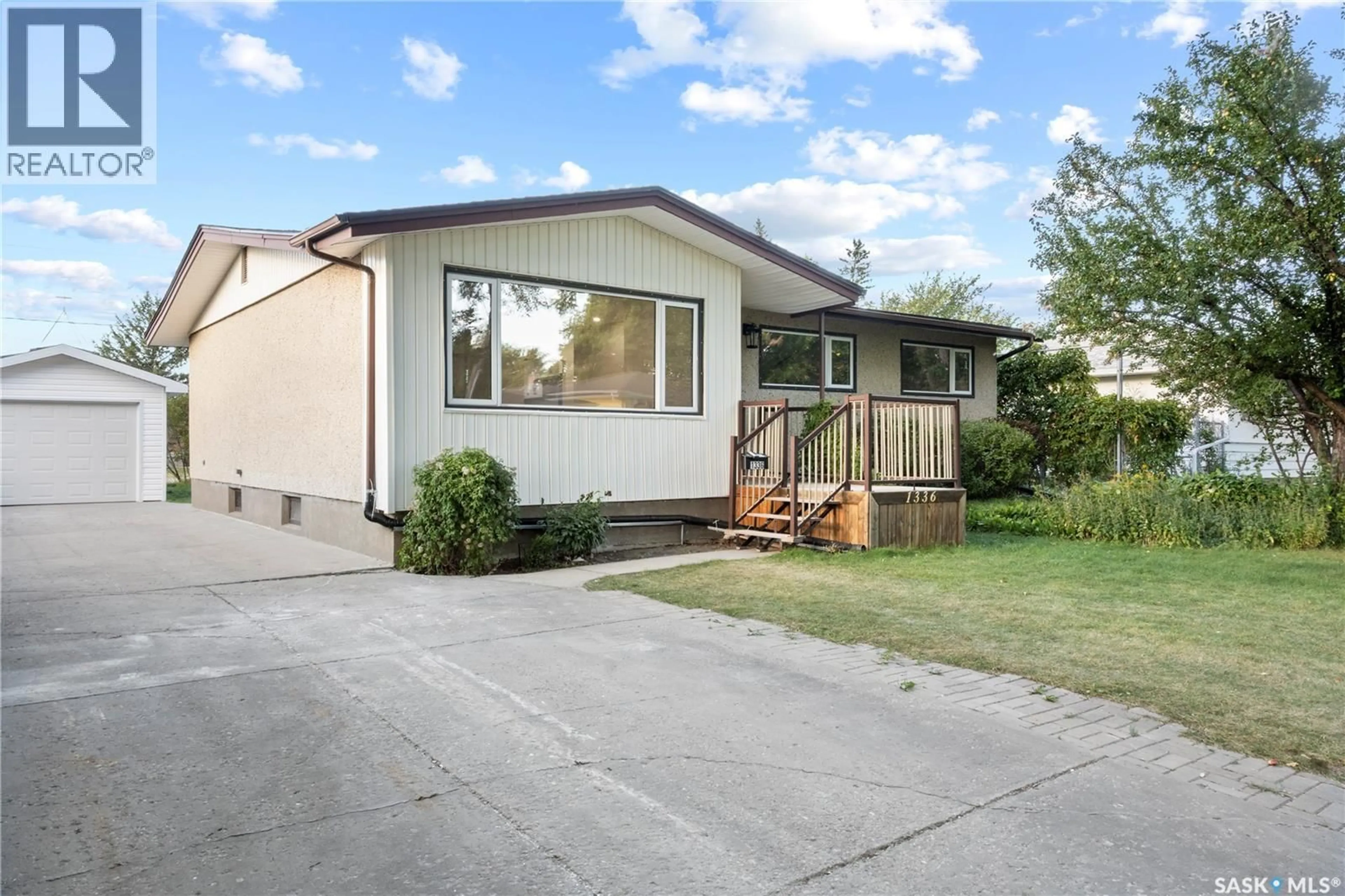 Home with vinyl exterior material, street for 1336 MCNIVEN AVENUE, Regina Saskatchewan S4S3X8
