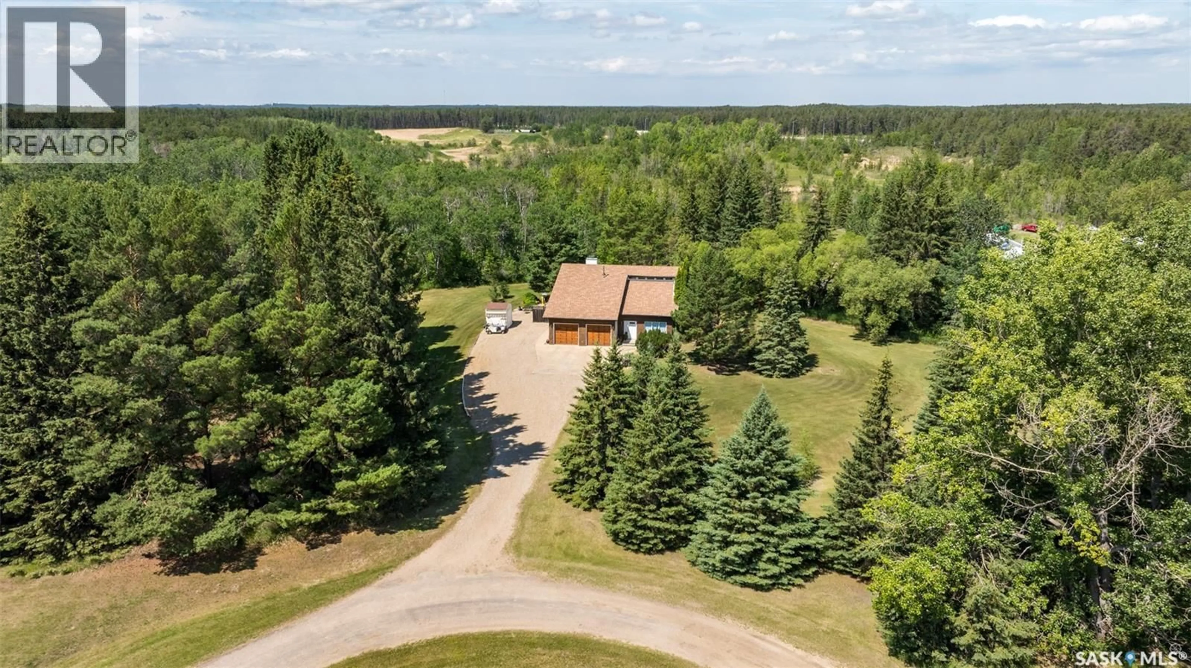 A pic from outside/outdoor area/front of a property/back of a property/a pic from drone, forest/trees view for 461 BIRCH PLACE, Buckland Rm No. 491 Saskatchewan S6V5R3