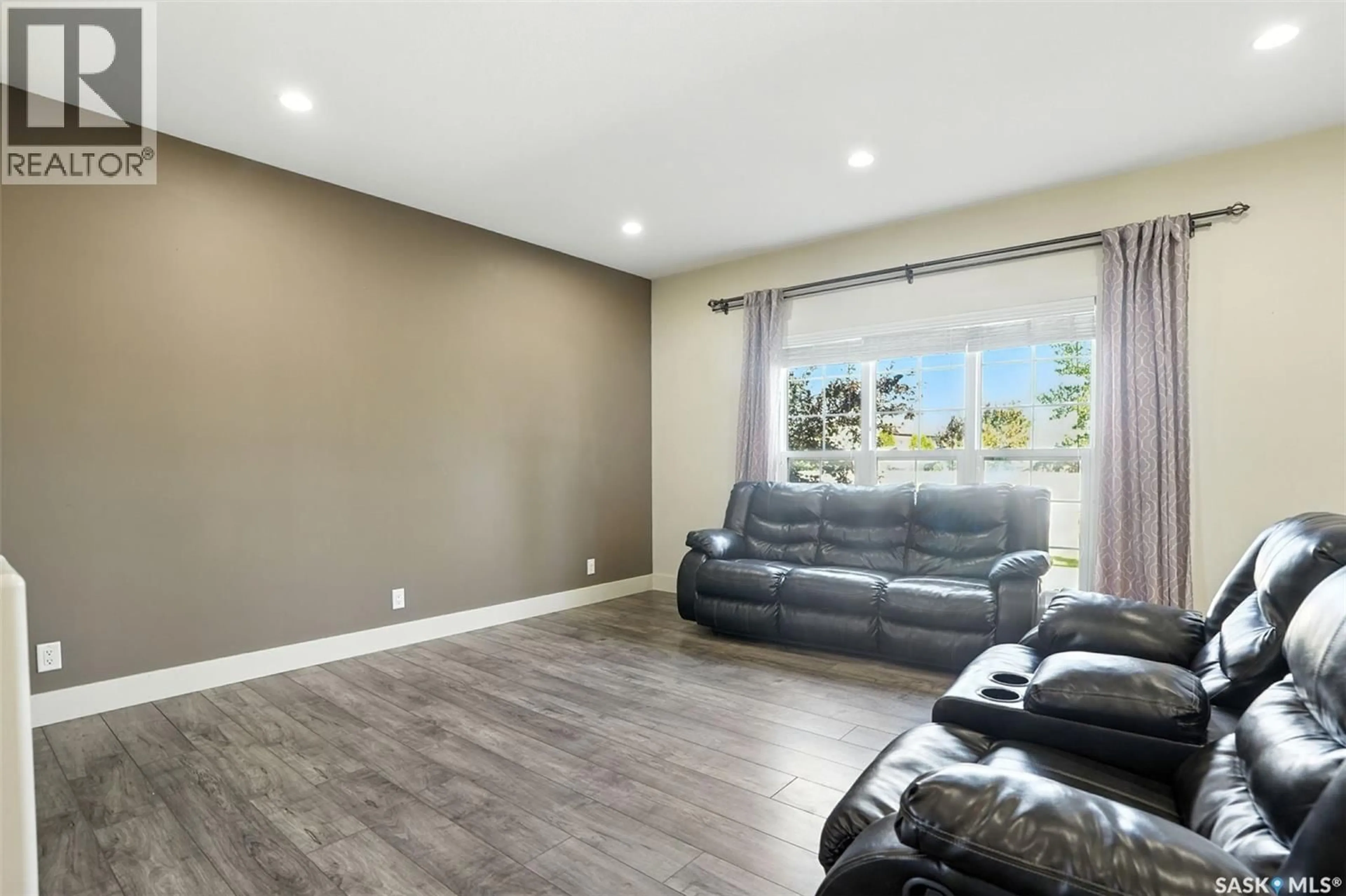 Living room with furniture, unknown for 707 REDDEKOPP DRIVE, Martensville Saskatchewan S0K0A2