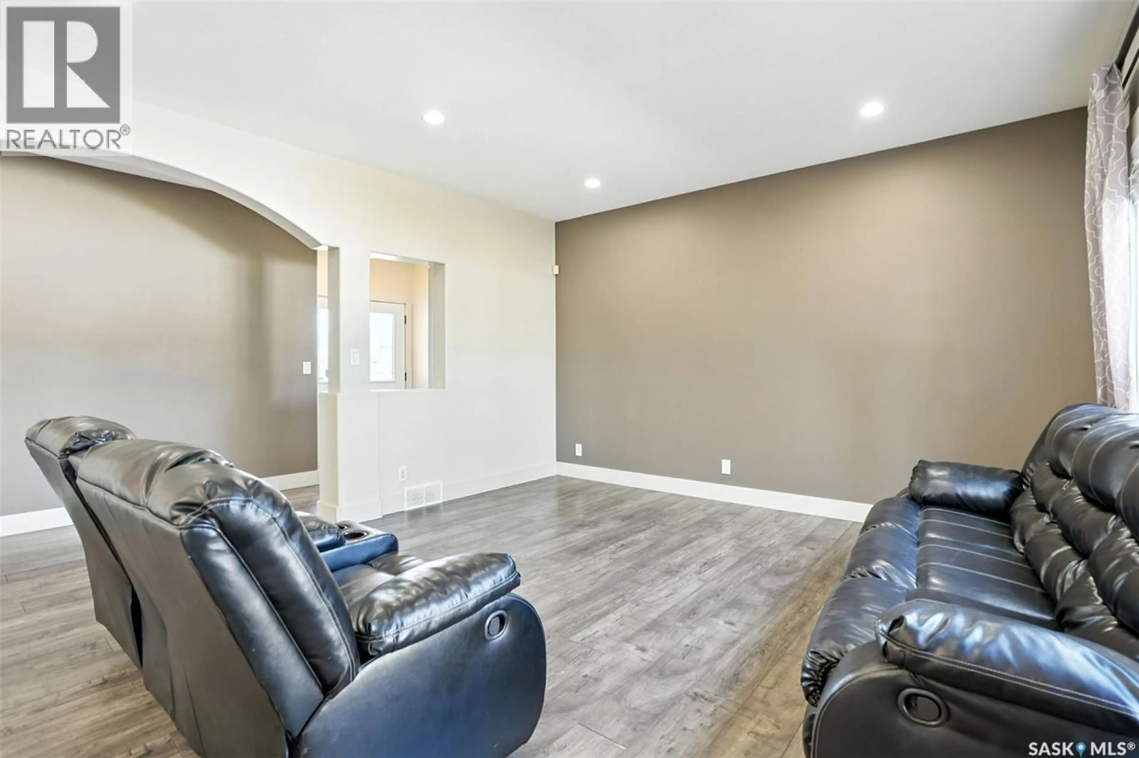 Living room with furniture, unknown for 707 REDDEKOPP DRIVE, Martensville Saskatchewan S0K0A2