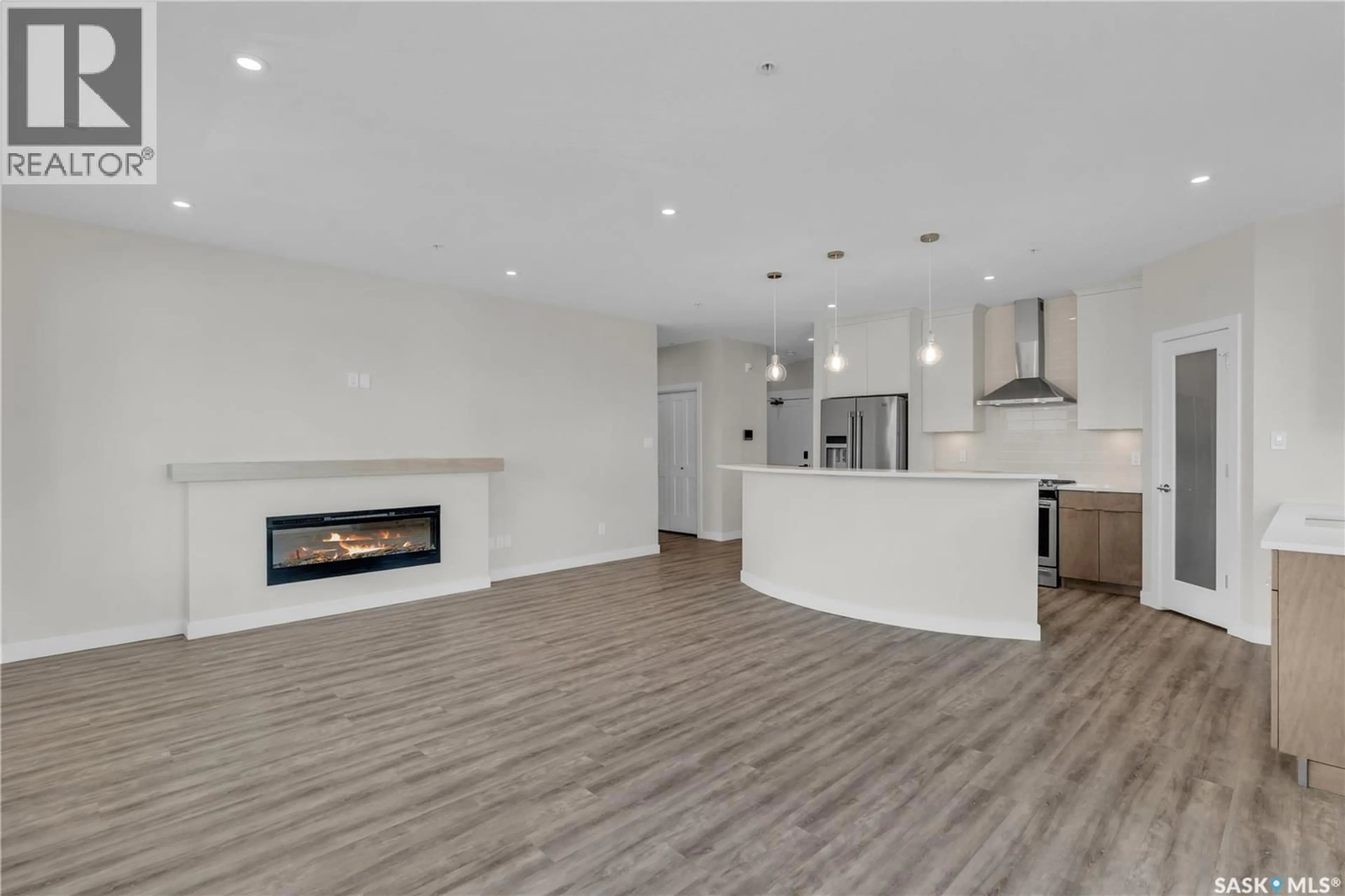 Open concept kitchen, wood/laminate floor for 3581 - 201 EVANS COURT, Regina Saskatchewan S4S7A3