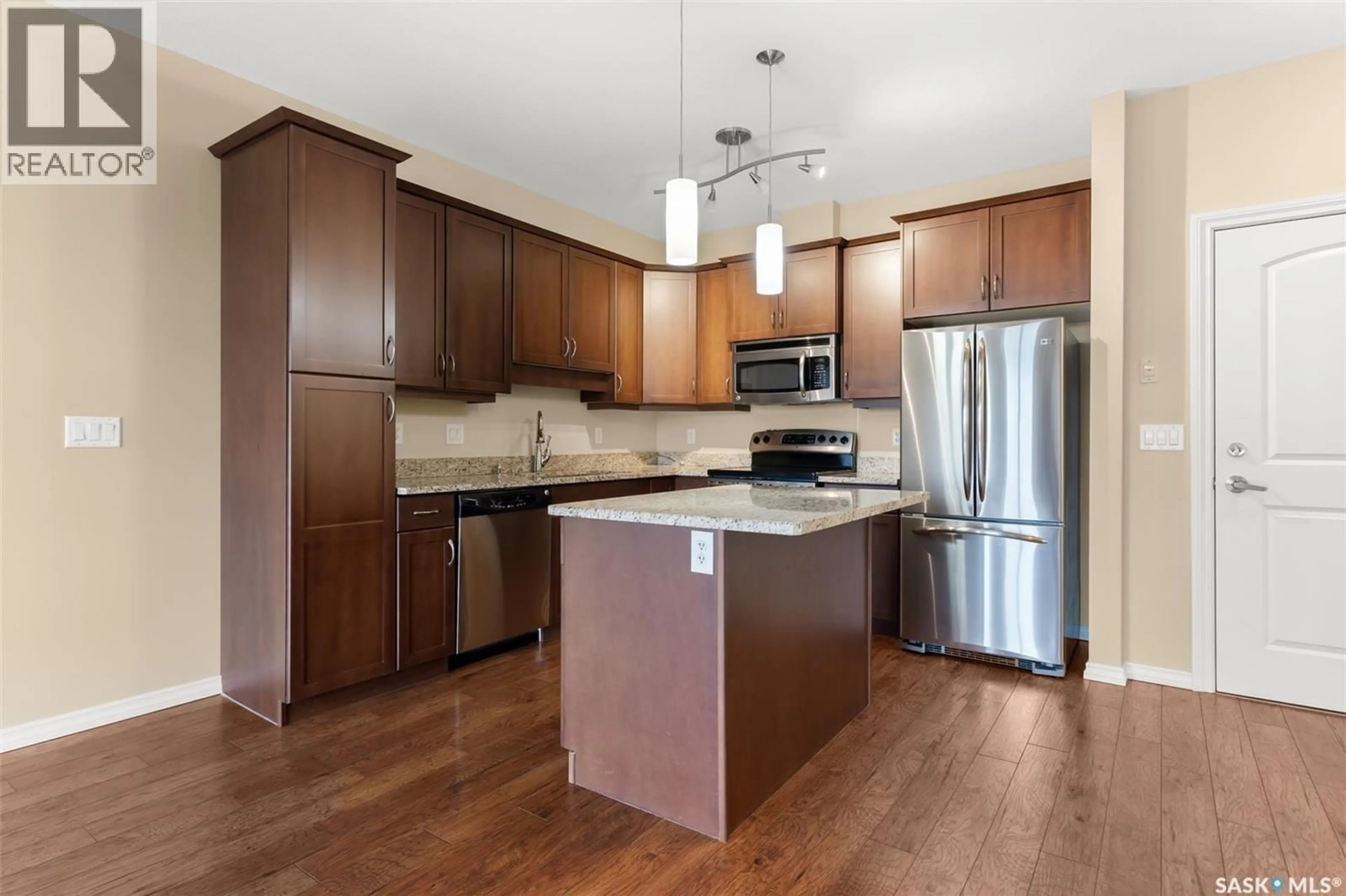 Open concept kitchen, wood/laminate floor for 2160 - 311 HESELTINE ROAD, Regina Saskatchewan S4V1L2