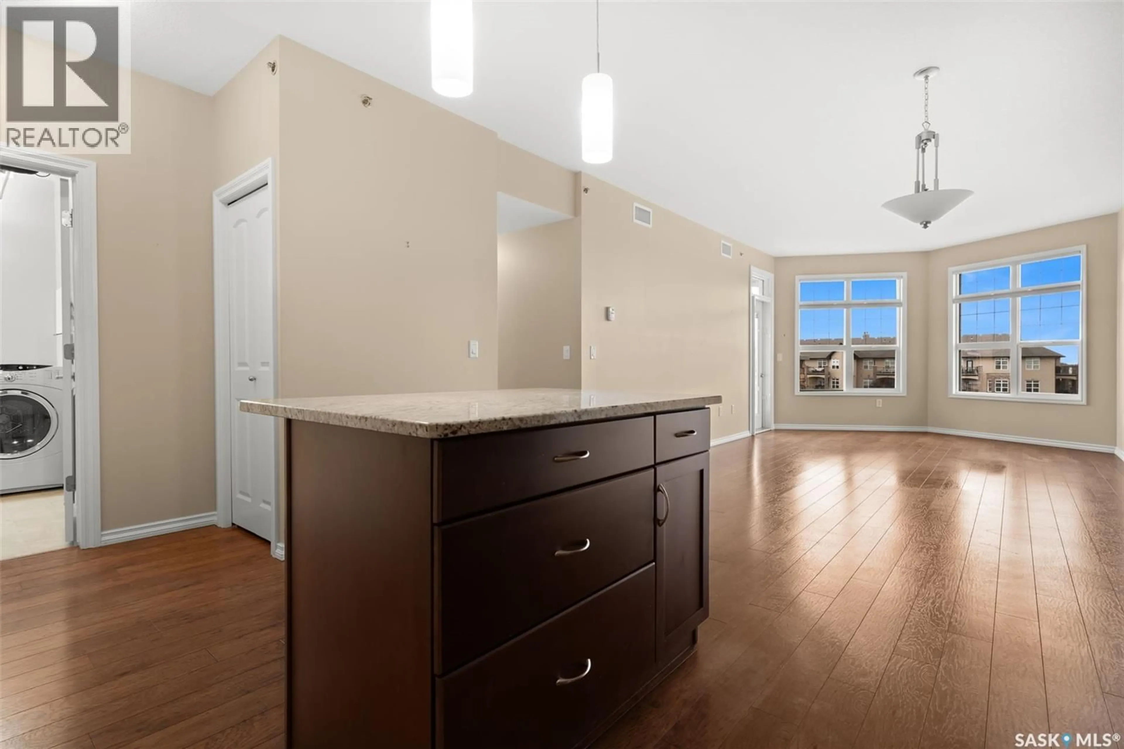 Open concept kitchen, wood/laminate floor for 2160 - 311 HESELTINE ROAD, Regina Saskatchewan S4V1L2