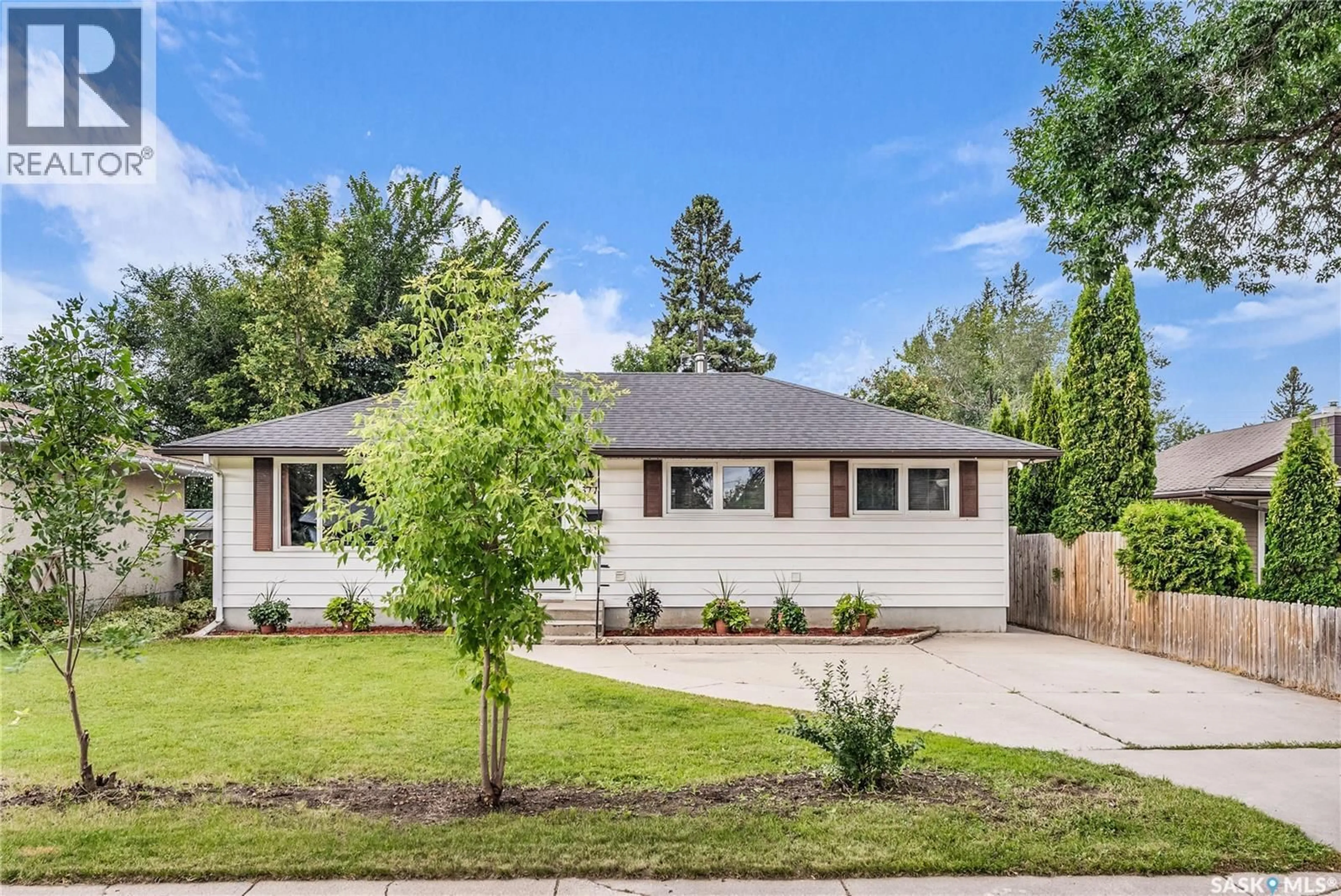 Home with vinyl exterior material, street for 311 HILLIARD STREET, Saskatoon Saskatchewan S7J0E5