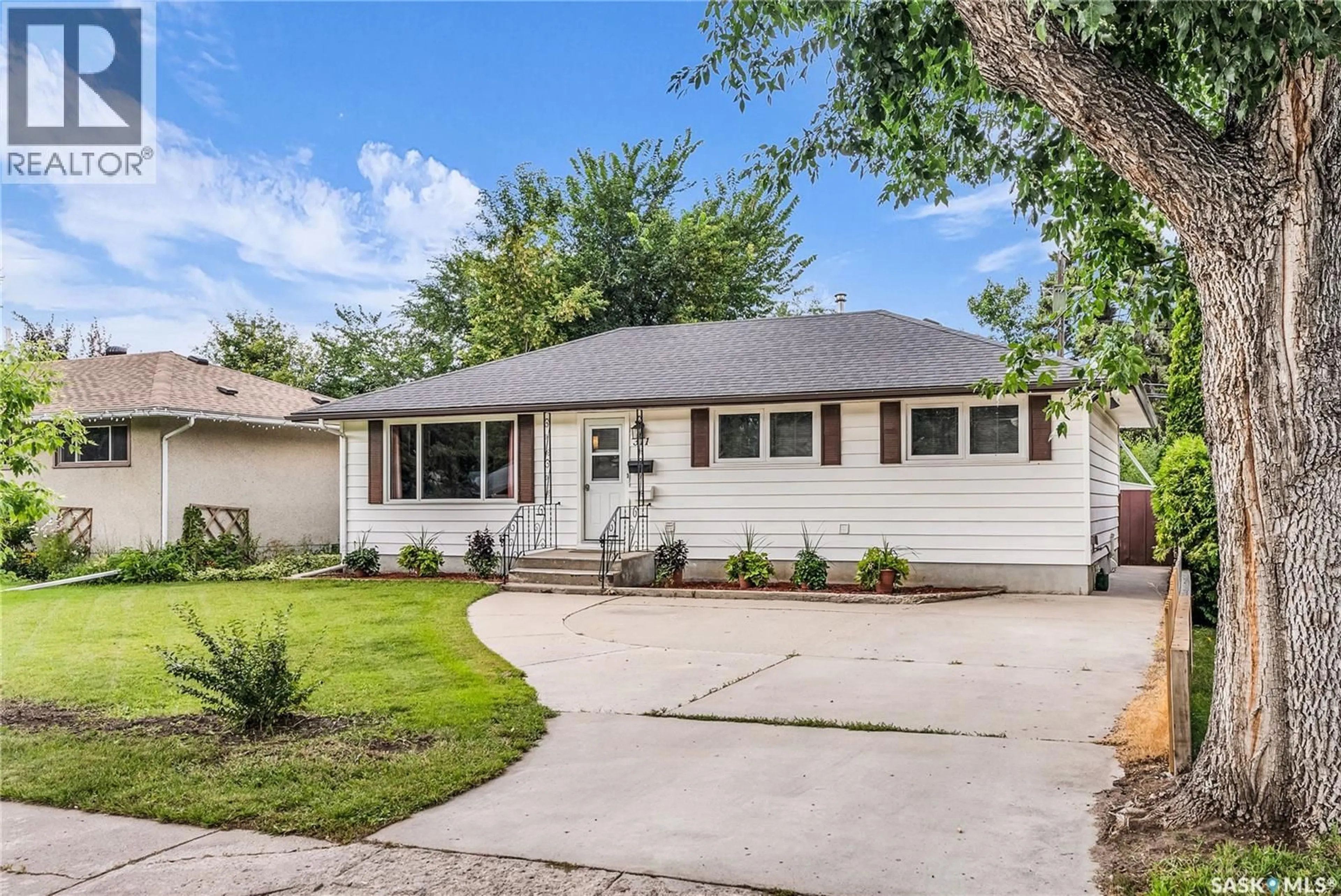 Home with vinyl exterior material, street for 311 HILLIARD STREET, Saskatoon Saskatchewan S7J0E5