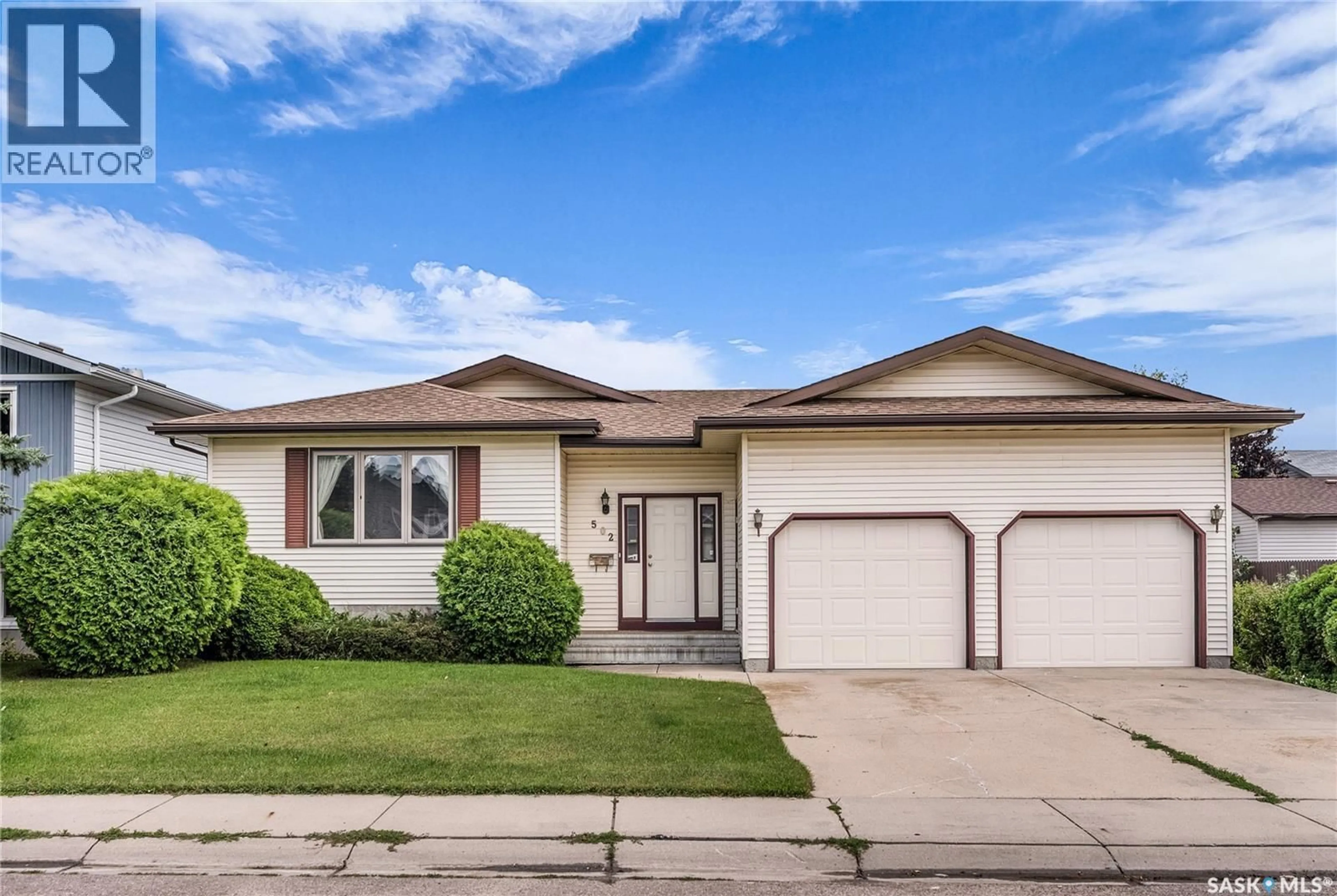 Home with vinyl exterior material, street for 502 HALL CRESCENT, Saskatoon Saskatchewan S7L7H3