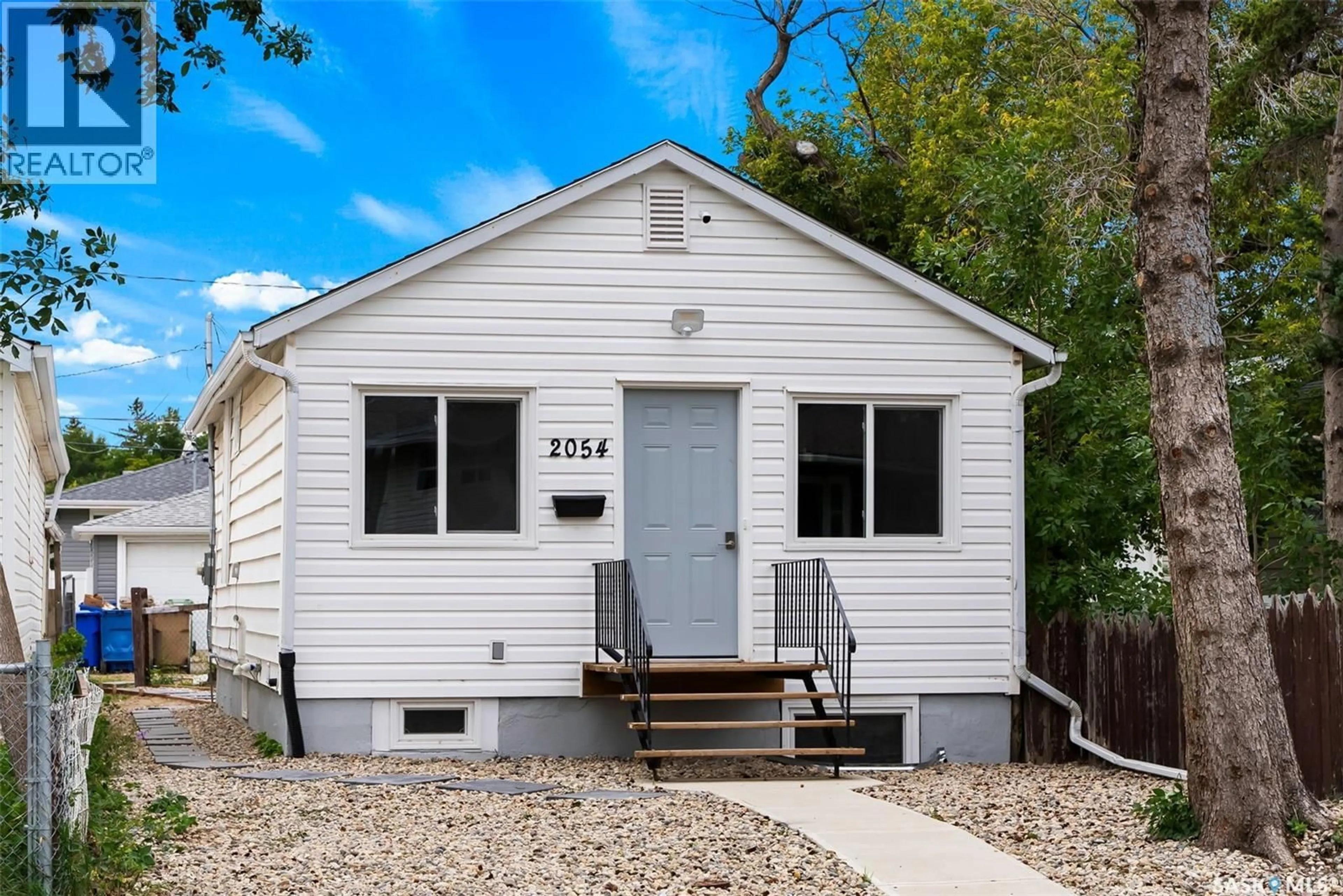 Home with vinyl exterior material, street for 2054 EMBURY STREET, Regina Saskatchewan S4N2L6