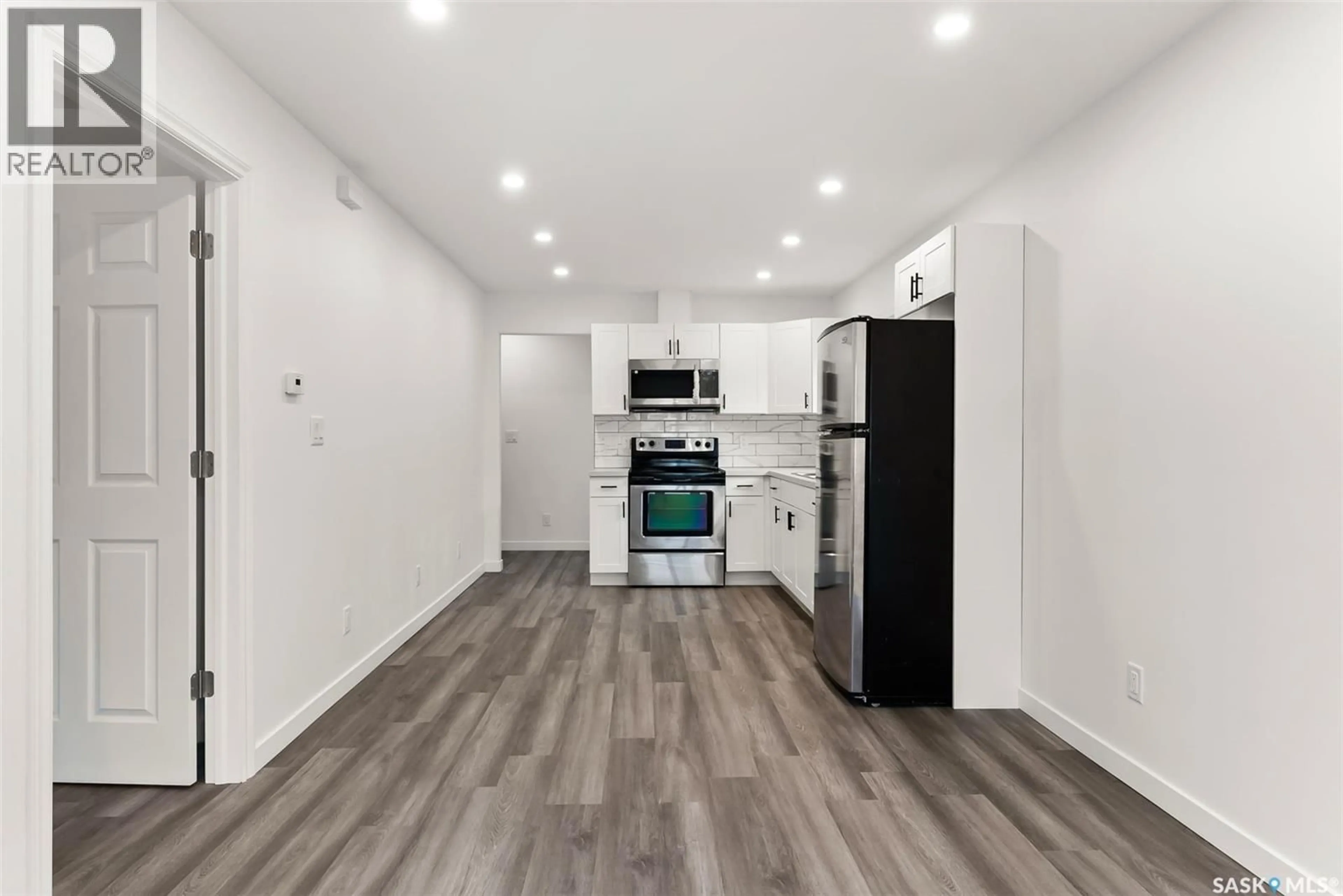 Open concept kitchen, wood/laminate floor for 2054 EMBURY STREET, Regina Saskatchewan S4N2L6