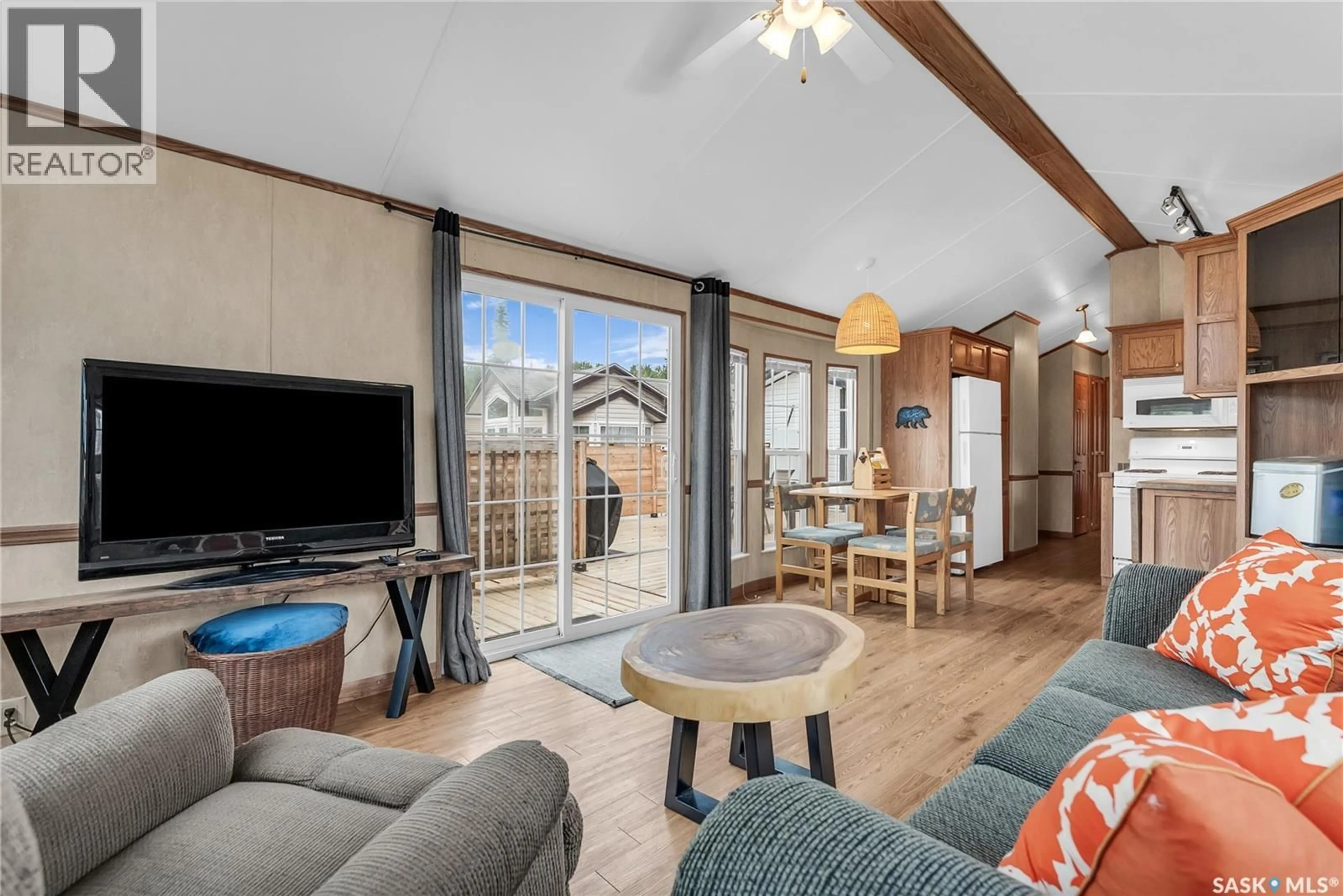 Living room with furniture, wood/laminate floor for 43 NOBLES POINT, Candle Lake Saskatchewan S0J3E0