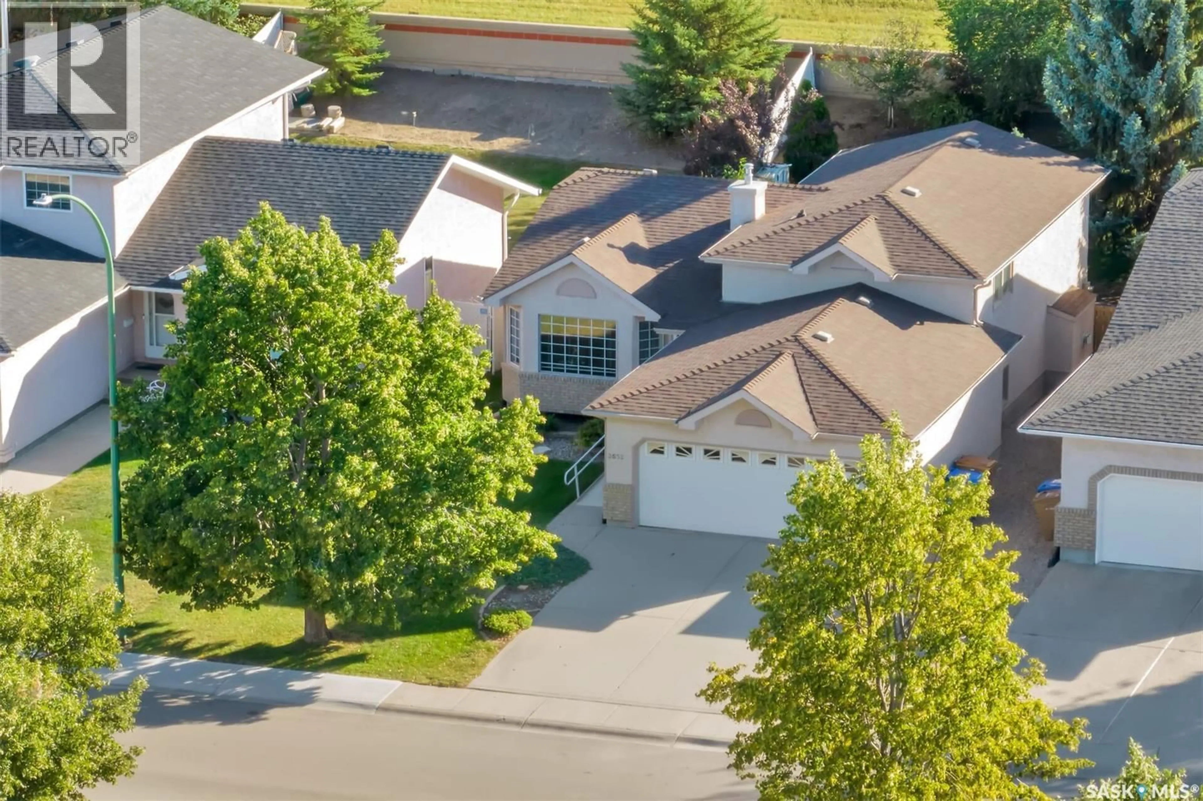 A pic from outside/outdoor area/front of a property/back of a property/a pic from drone, street for 3532 HAZEL GROVE DRIVE, Regina Saskatchewan S4V2S7