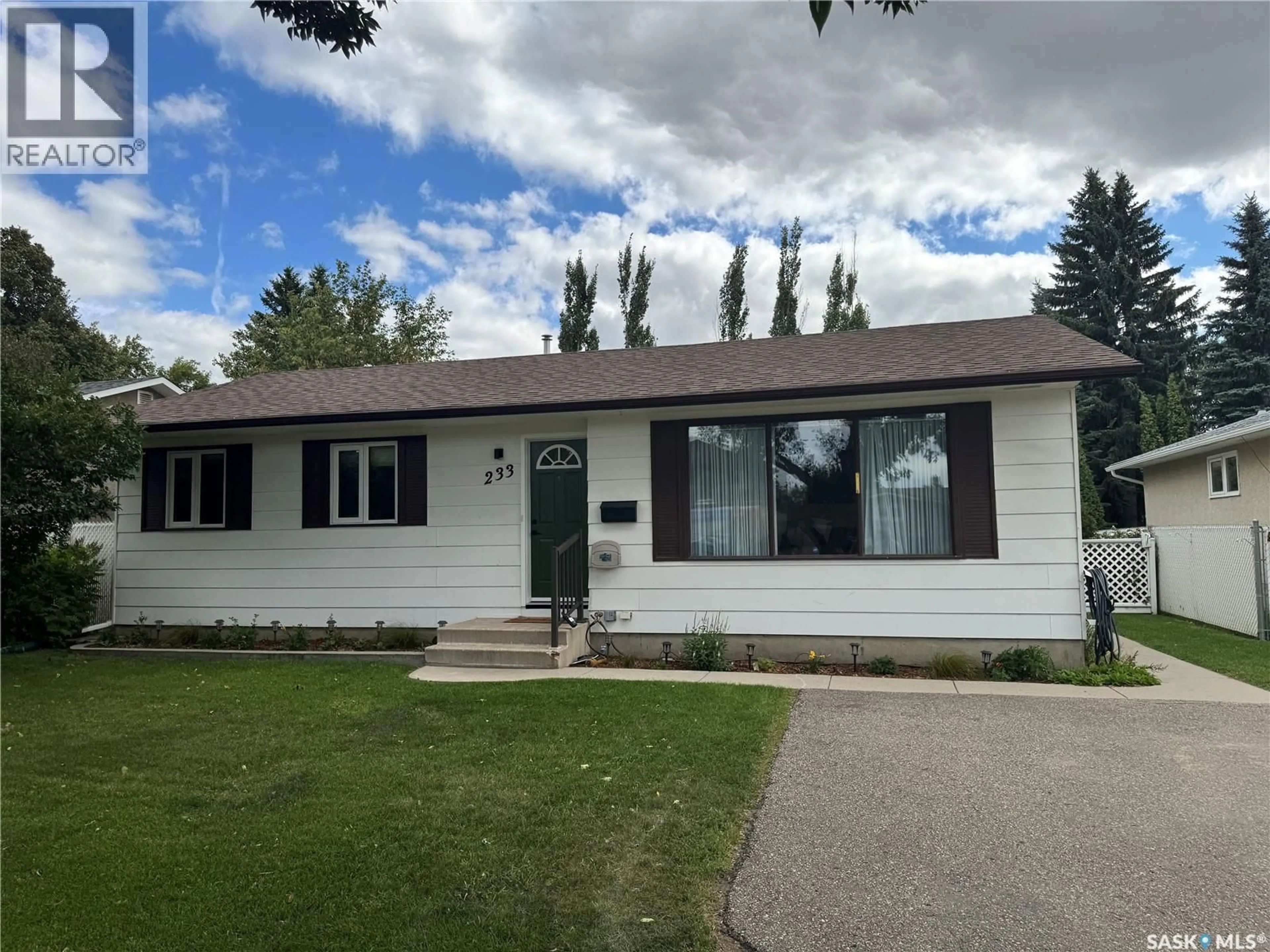 Home with vinyl exterior material, street for 233 ASSINIBOINE DRIVE, Saskatoon Saskatchewan S7K4A3