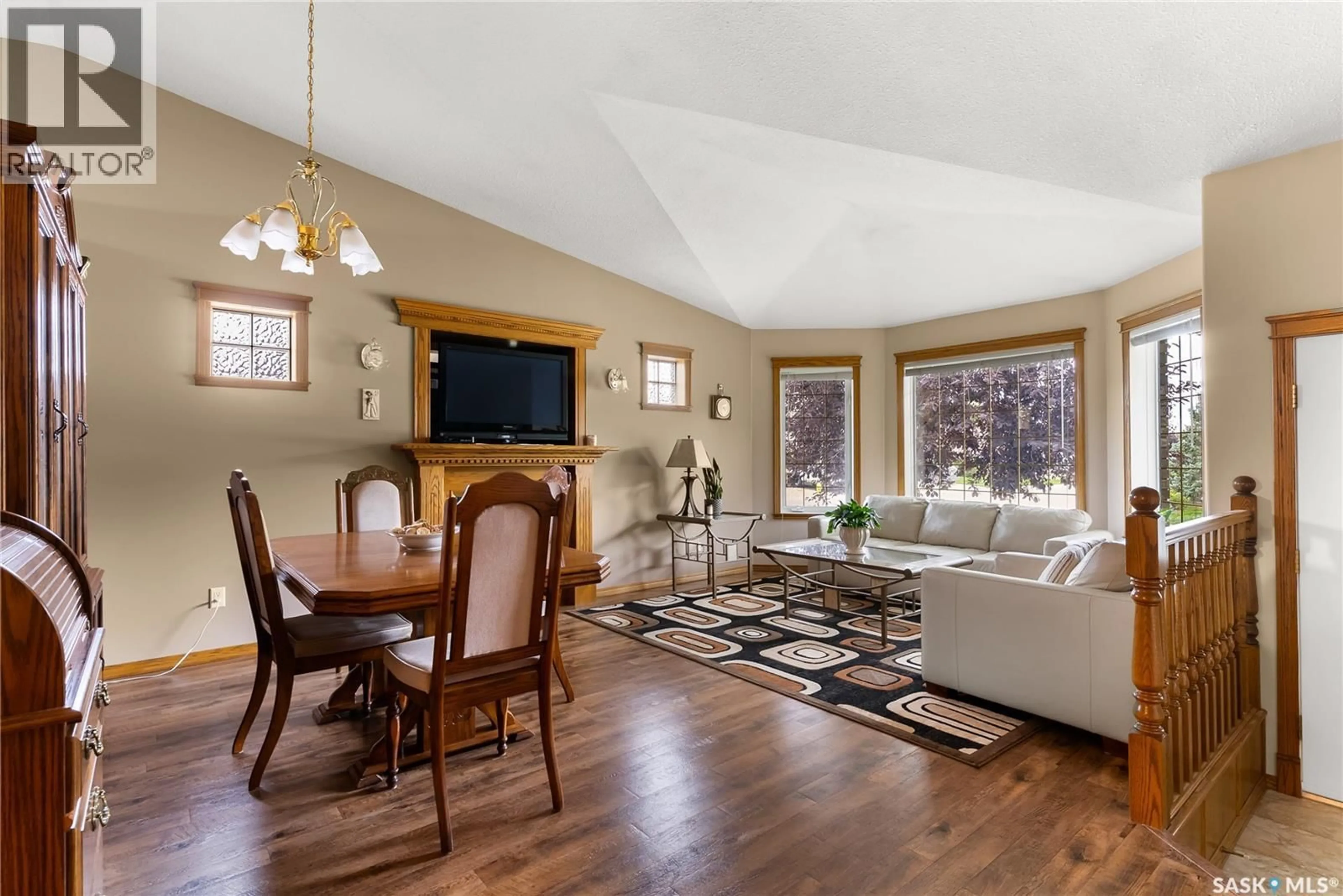 Living room with furniture, wood/laminate floor for 8504 THURSTON CRESCENT, Regina Saskatchewan S4Y1A2