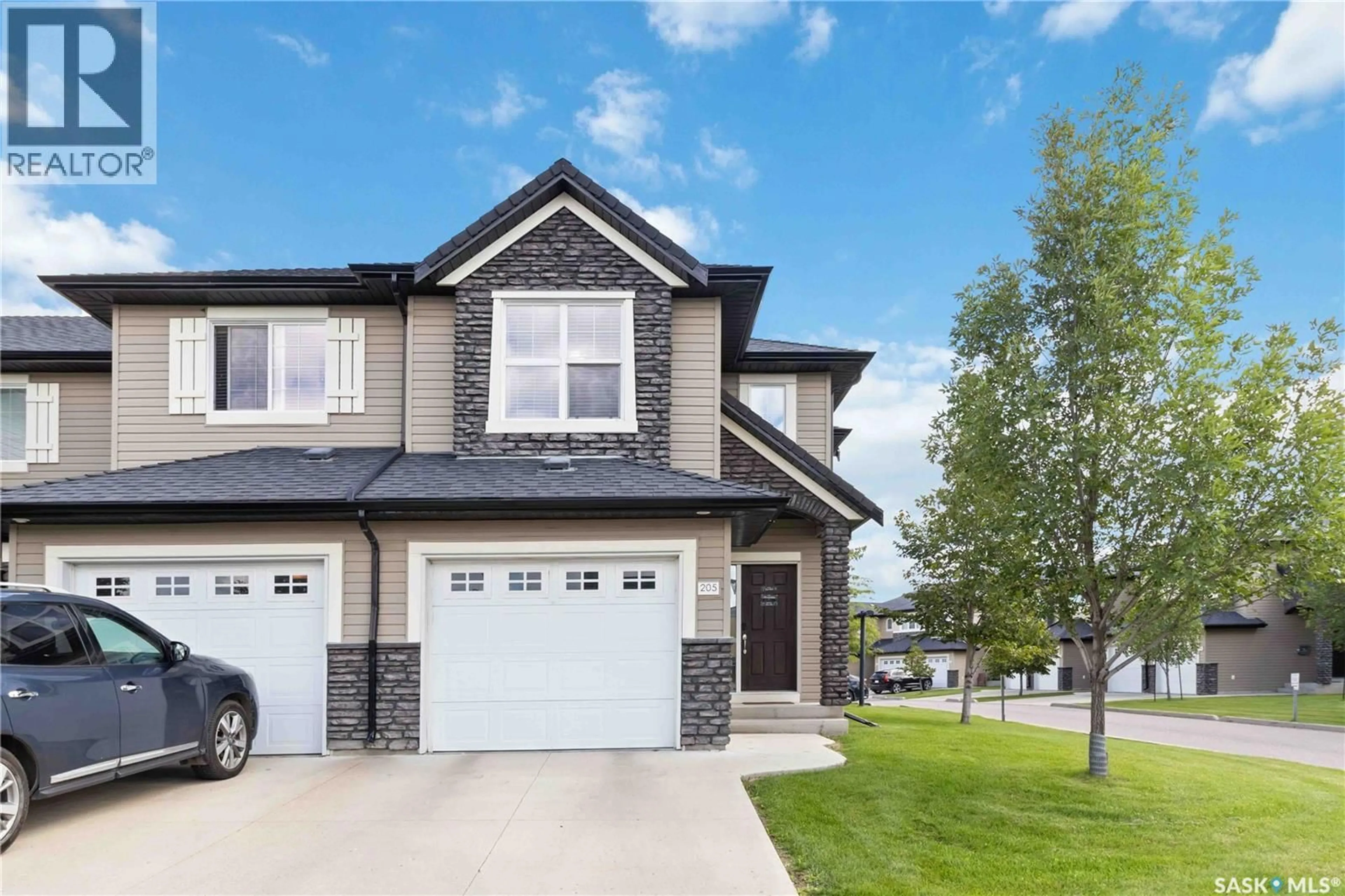 Home with vinyl exterior material, street for 205 - 410 LEDINGHAM WAY, Saskatoon Saskatchewan S7V0C4