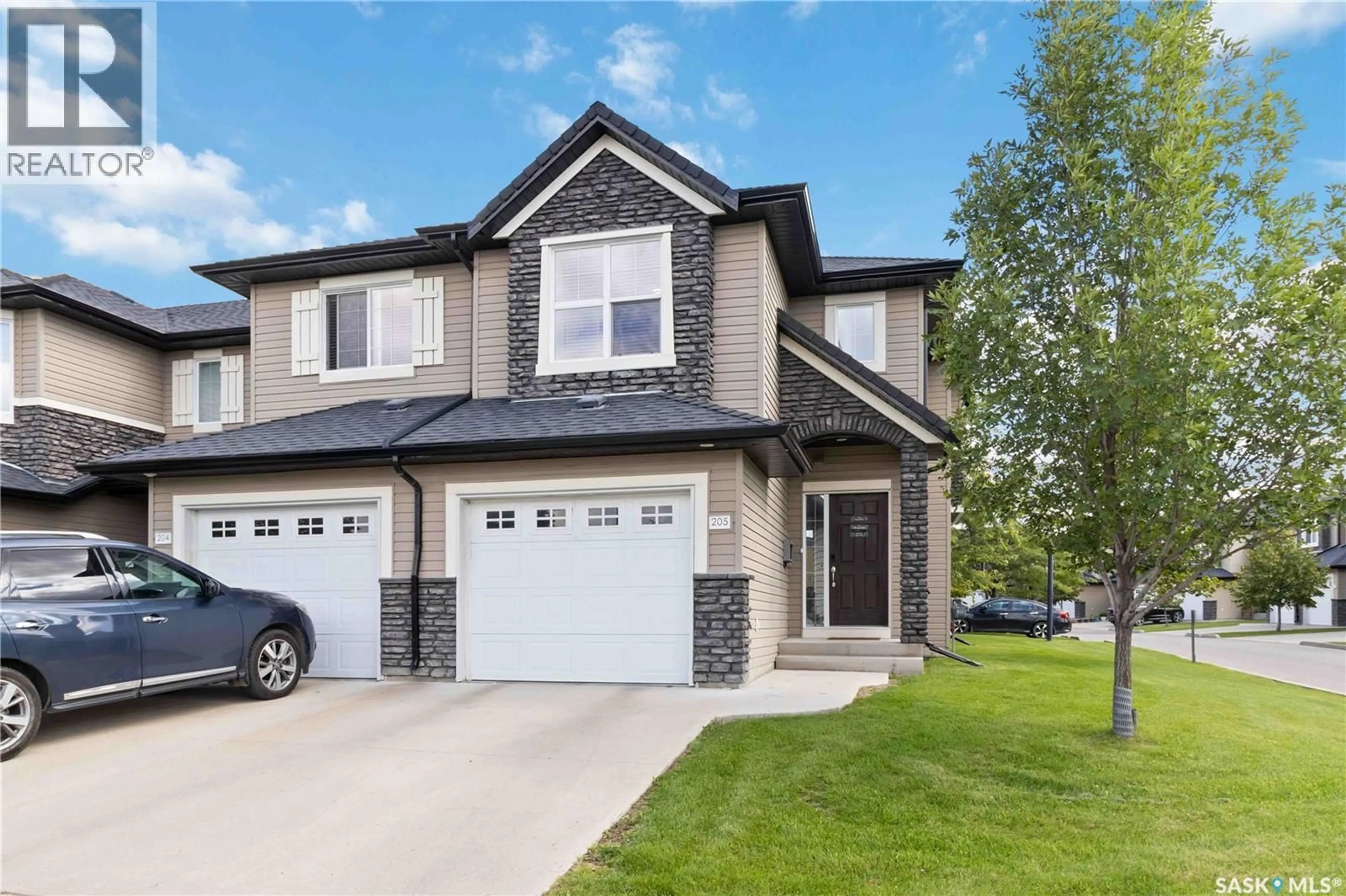 Home with vinyl exterior material, street for 205 - 410 LEDINGHAM WAY, Saskatoon Saskatchewan S7V0C4